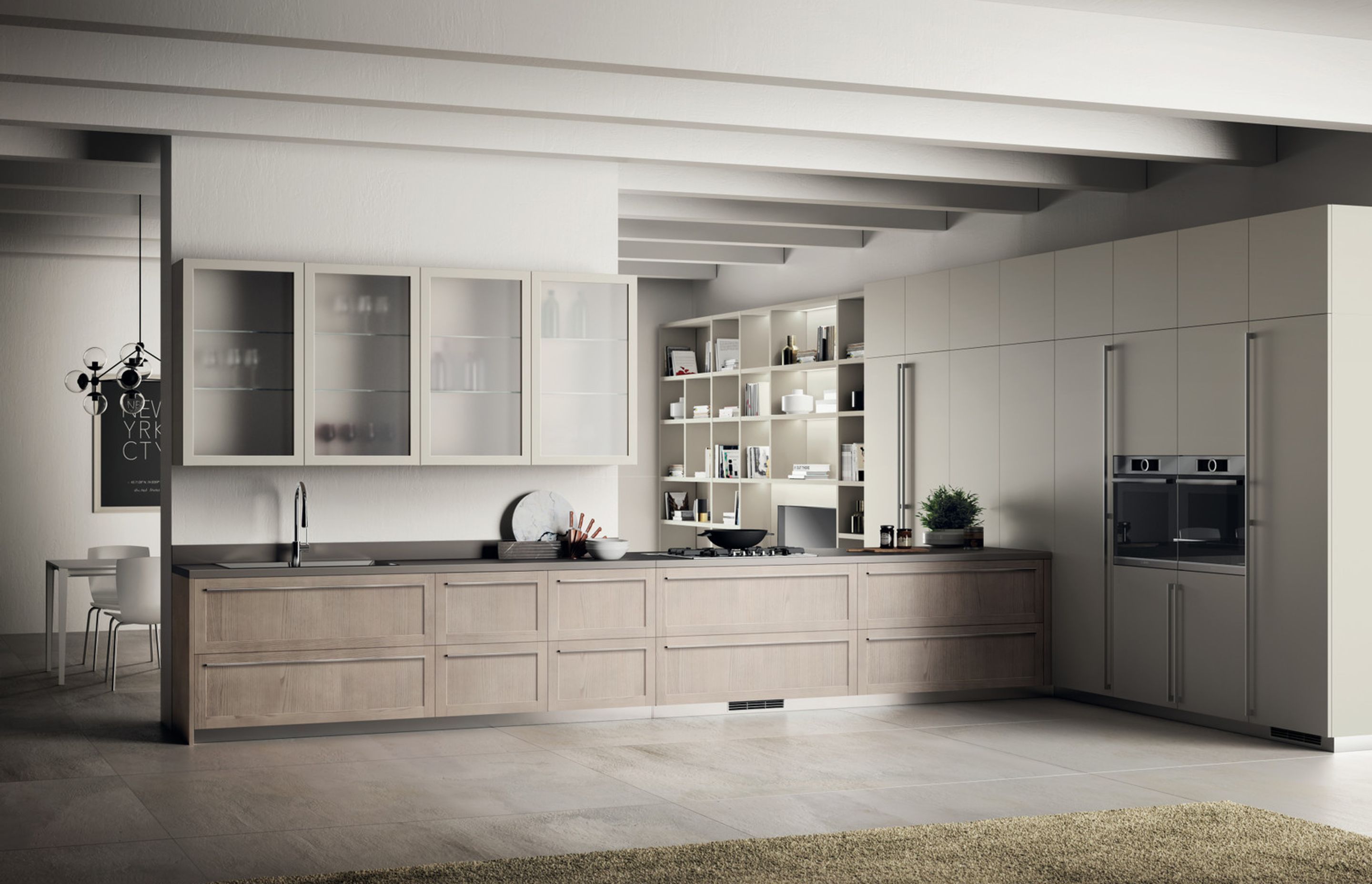 Structures, materials and nuances in perfect synch. Base units with Arena Ash frame door, with a more traditional feel, are teamed with wall and tall units with Dove Grey matt lacquered plain doors. The satin finish glass used on the wall units of this Carattere composition creates an appealing game of transparencies.