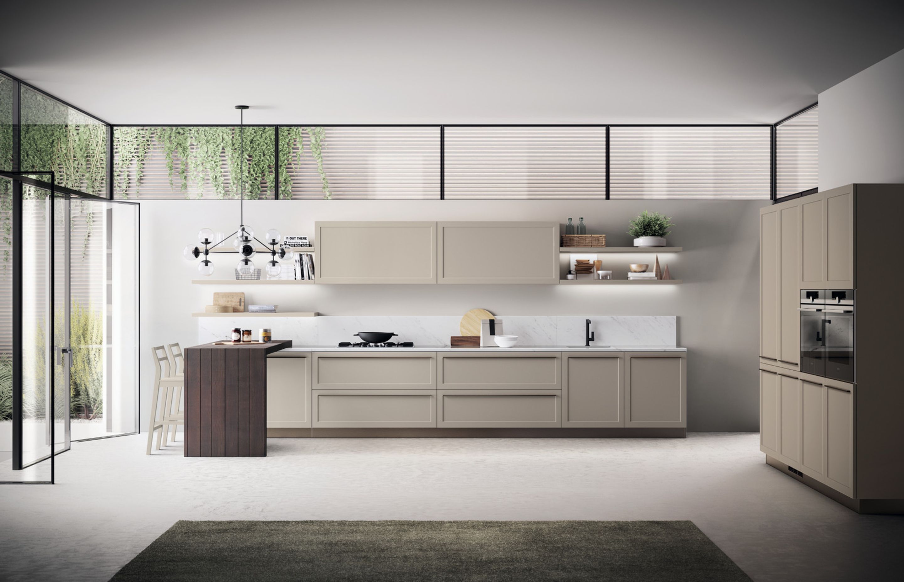 In a designer kitchen, light weight and symmetry cohabit in complete harmony, and clean-cut geometries stand out, along with well-defined corners. In this Mink matt lacquered version of Carattere, the details make the space utterly exclusive: Bronze finish handles, which look like an elegant graphic sign, and the 45-degree processing of the imposing Nabuk Oak breakfast bench.