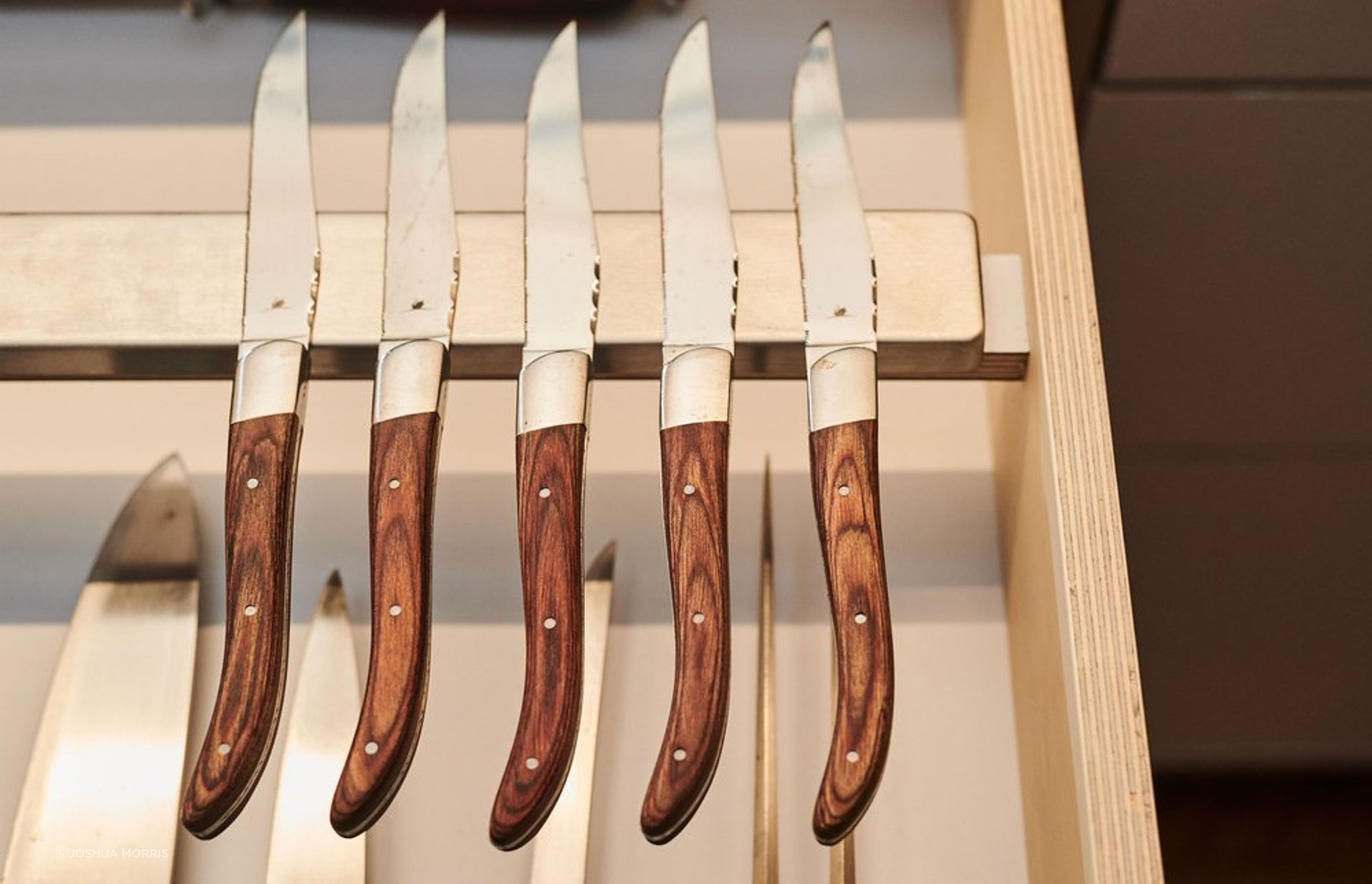 Chris’ drawers are tailored to suit his expansive collection of cookware and utensils.