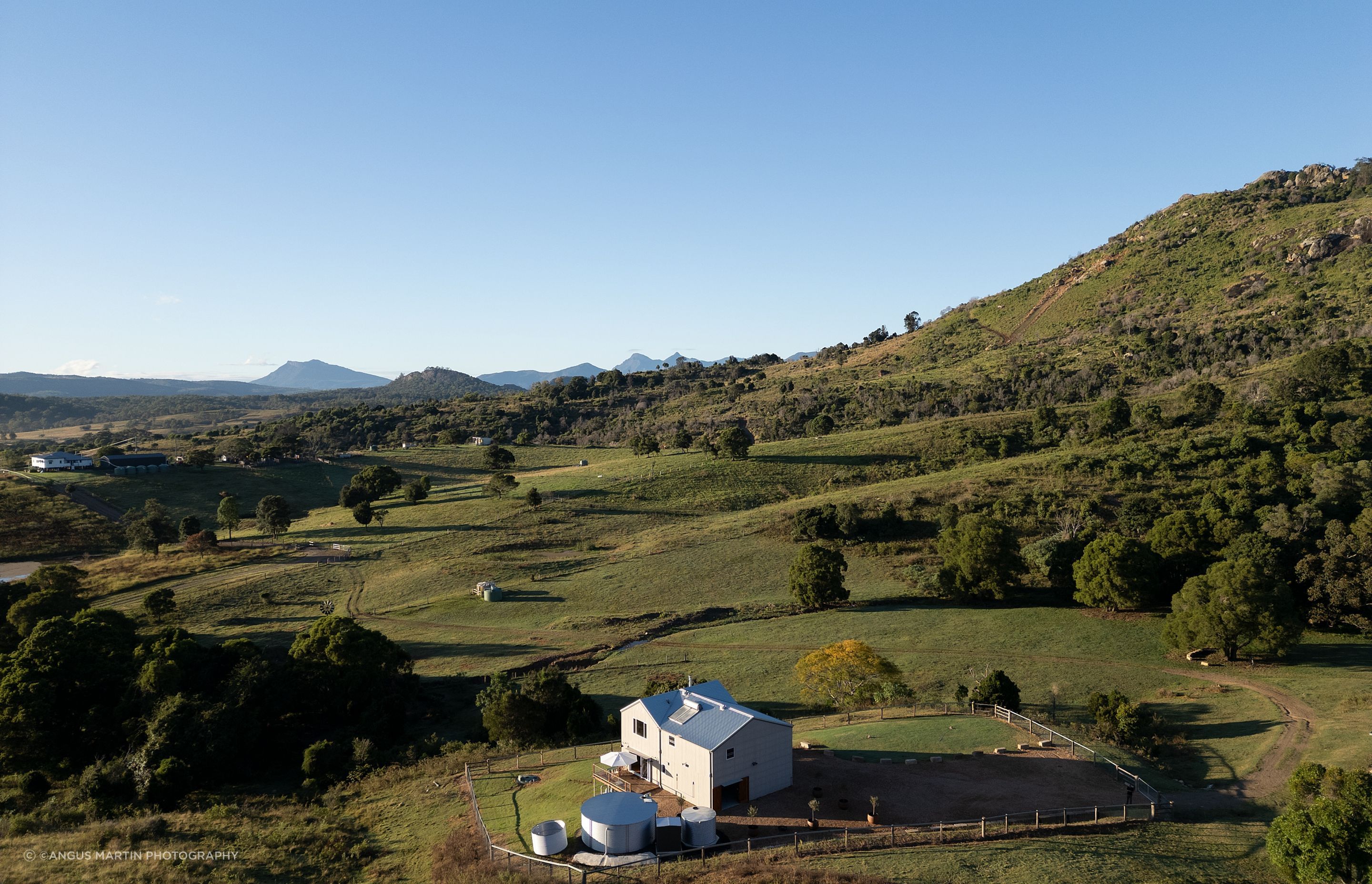 Set in the lee of Mount Alford, this off-grid home reinterprets the iconic Australian farm shed through the lens of contemporary, high-performance design.