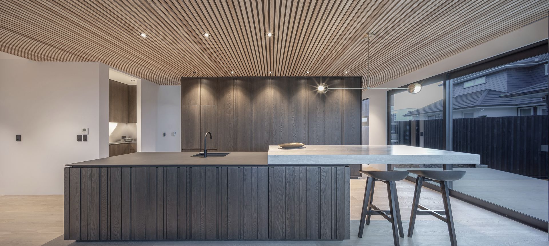 Dramatic kitchen with handleless design in a rural setting banner