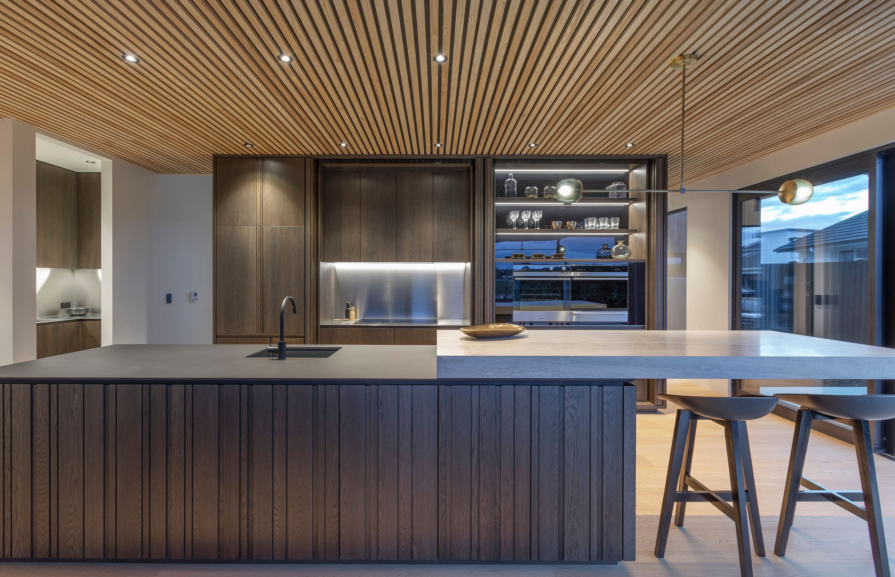 Dramatic kitchen with handleless design in a rural setting