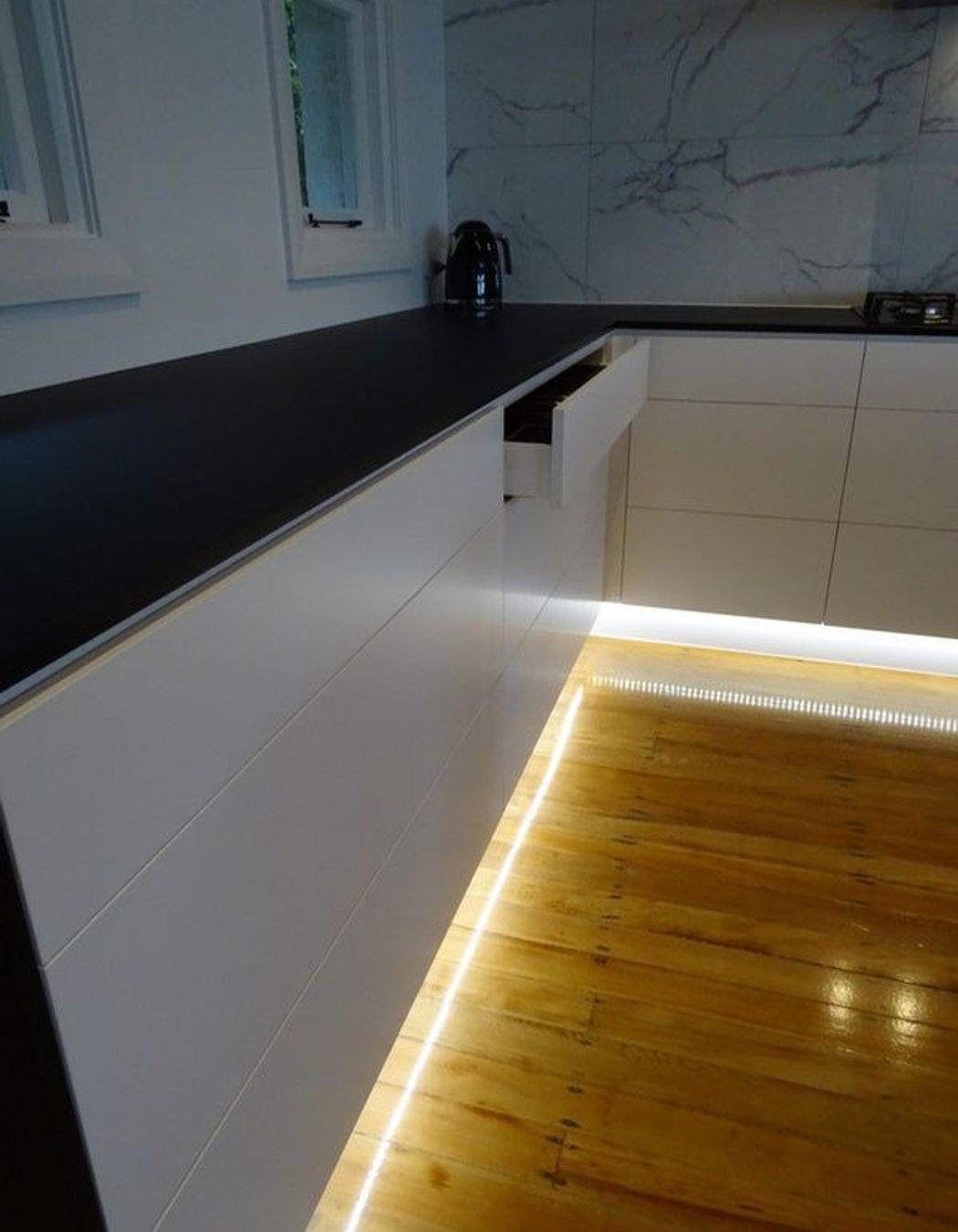 Kitchen appliances and joinery merge in this modern Dunedin kitchen