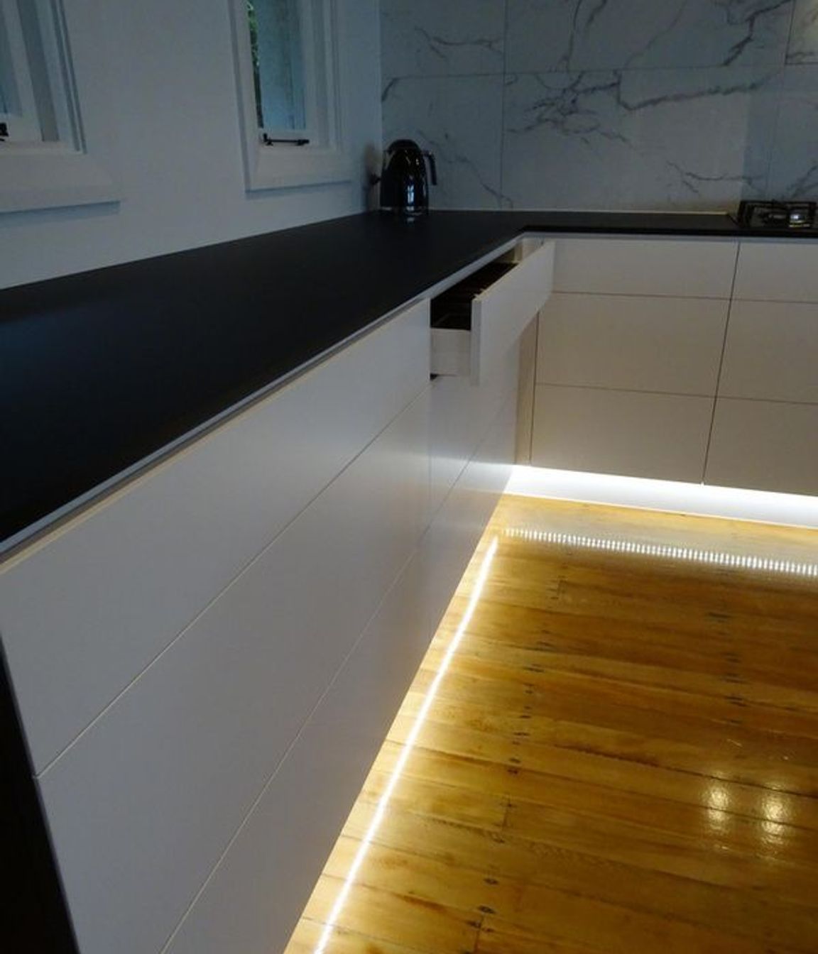 Kitchen appliances and joinery merge in this modern Dunedin kitchen