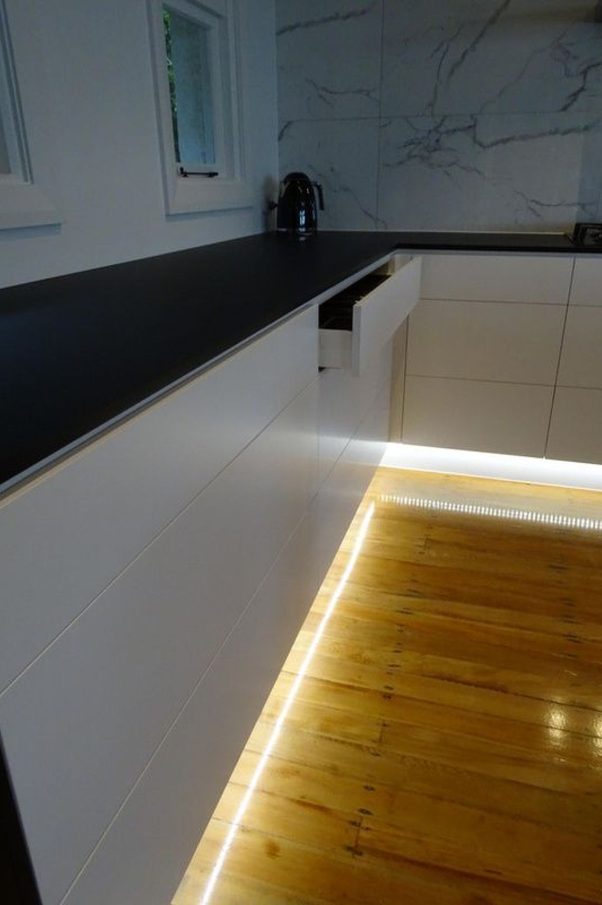 Kitchen appliances and joinery merge in this modern Dunedin kitchen