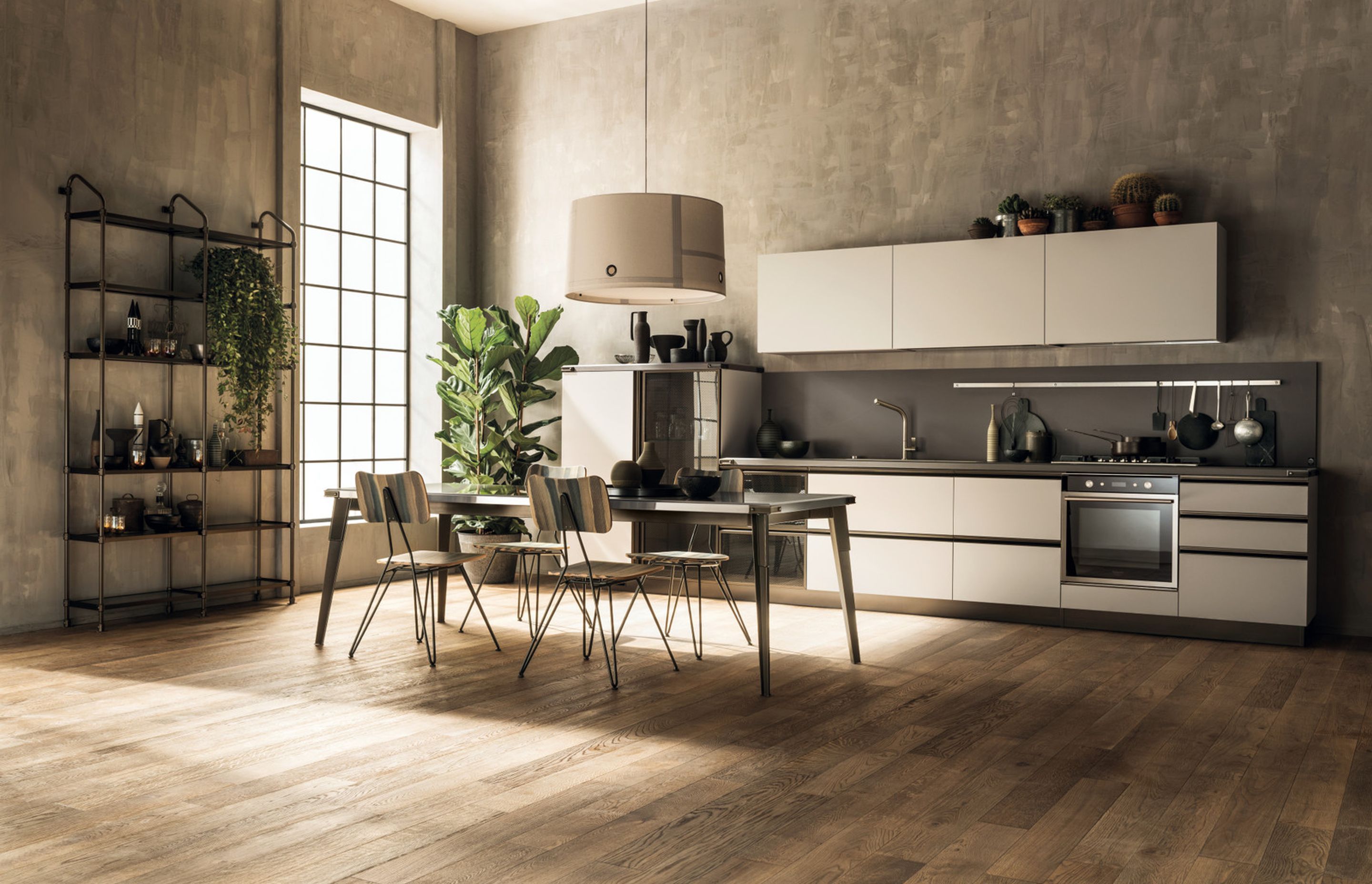 Simplicity, without foregoing Diesel style: Satin finish Moka Lapitec® top and the version in Smoky Glass with black mesh, combined with the base unit and mediumheight unit doors, distinguish this kitchen in Soft Beige decorative melamine.