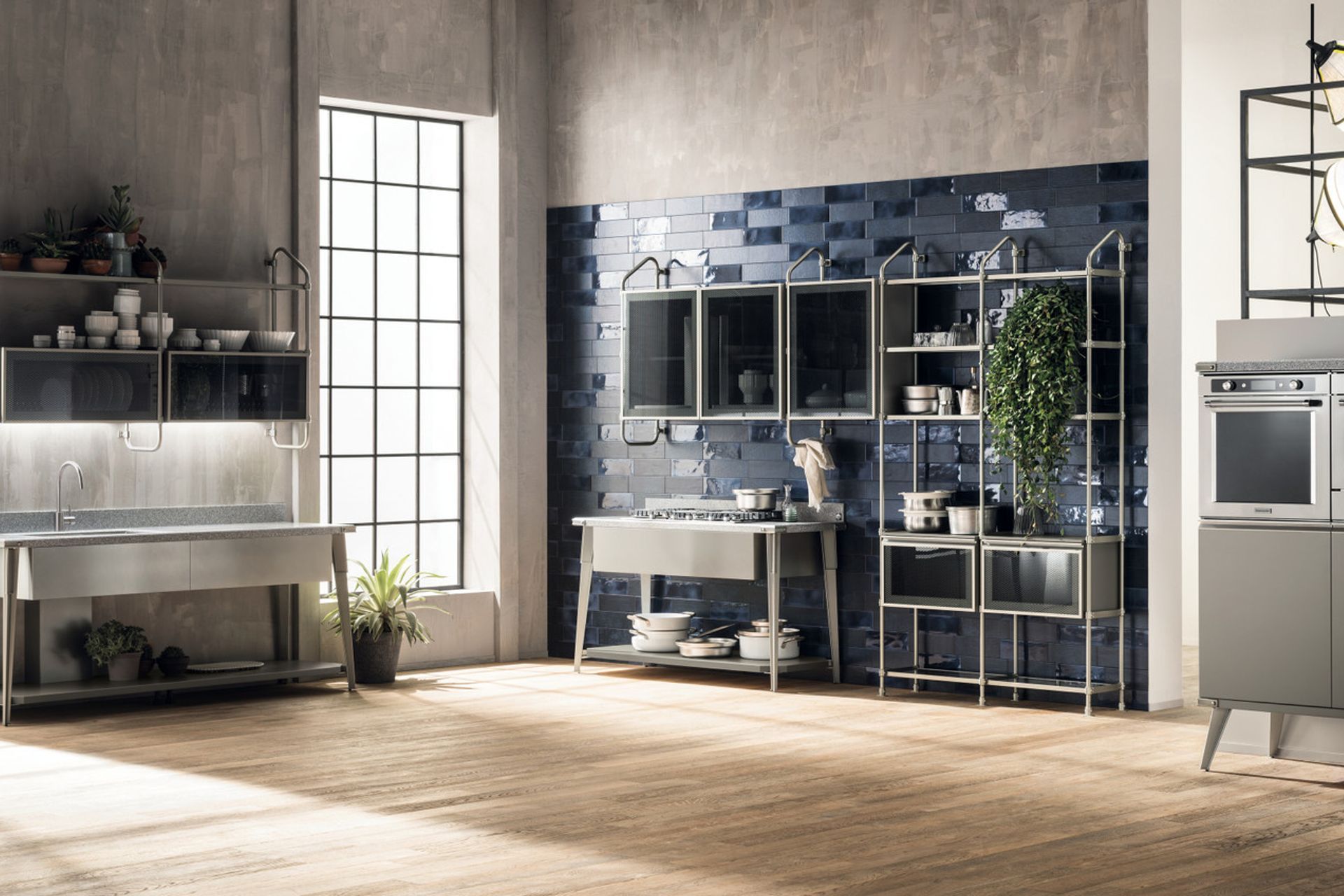 A “disjointed” composition where every single operating station manages to play the starring role and make the entire composition innovative. In the washing area, the large console with Platinum Corian® top and the undermount sink are distinguished by Soft Steel finish elements. The same mood, and the same materials, for the cooking area.