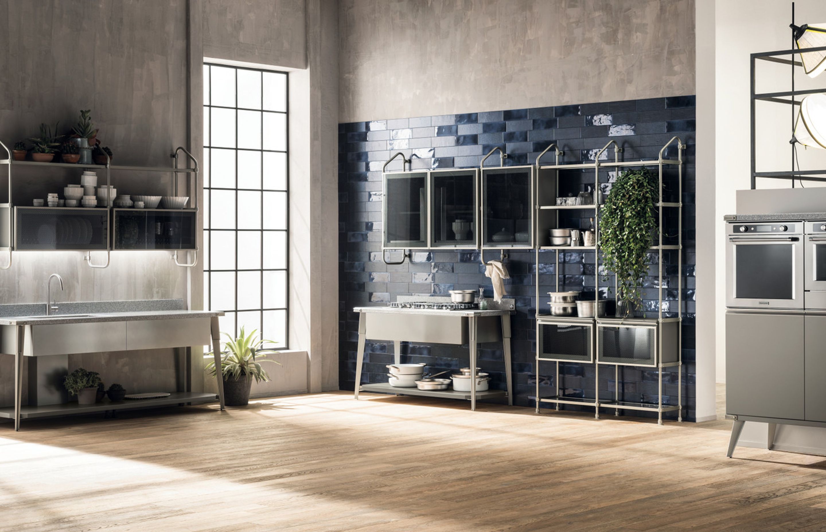 A “disjointed” composition where every single operating station manages to play the starring role and make the entire composition innovative. In the washing area, the large console with Platinum Corian® top and the undermount sink are distinguished by Soft Steel finish elements. The same mood, and the same materials, for the cooking area.