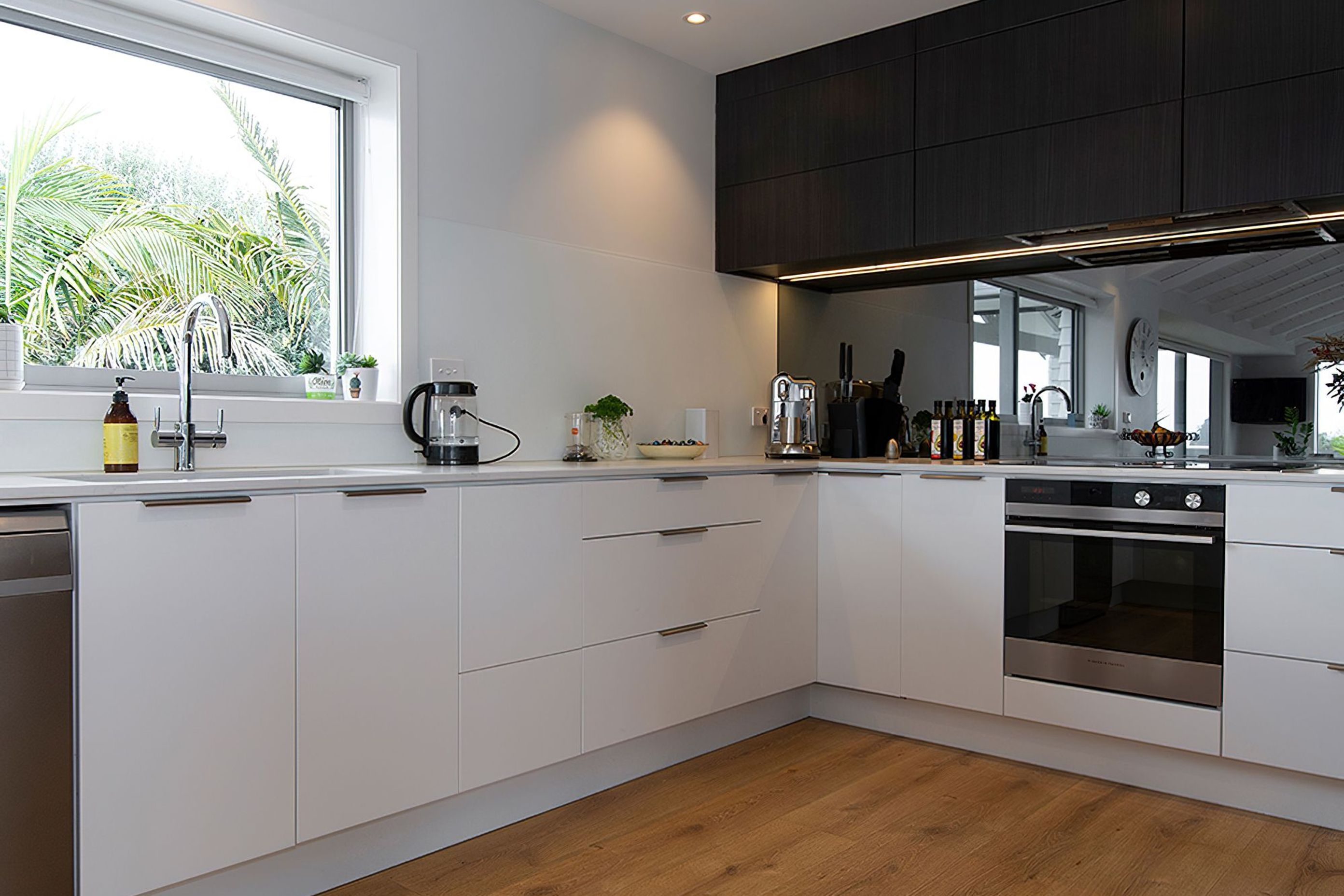 Milan profile in Hacienda Black - Woodgrain. Design by Modern Kitchens. Photography by Liam Dijk.