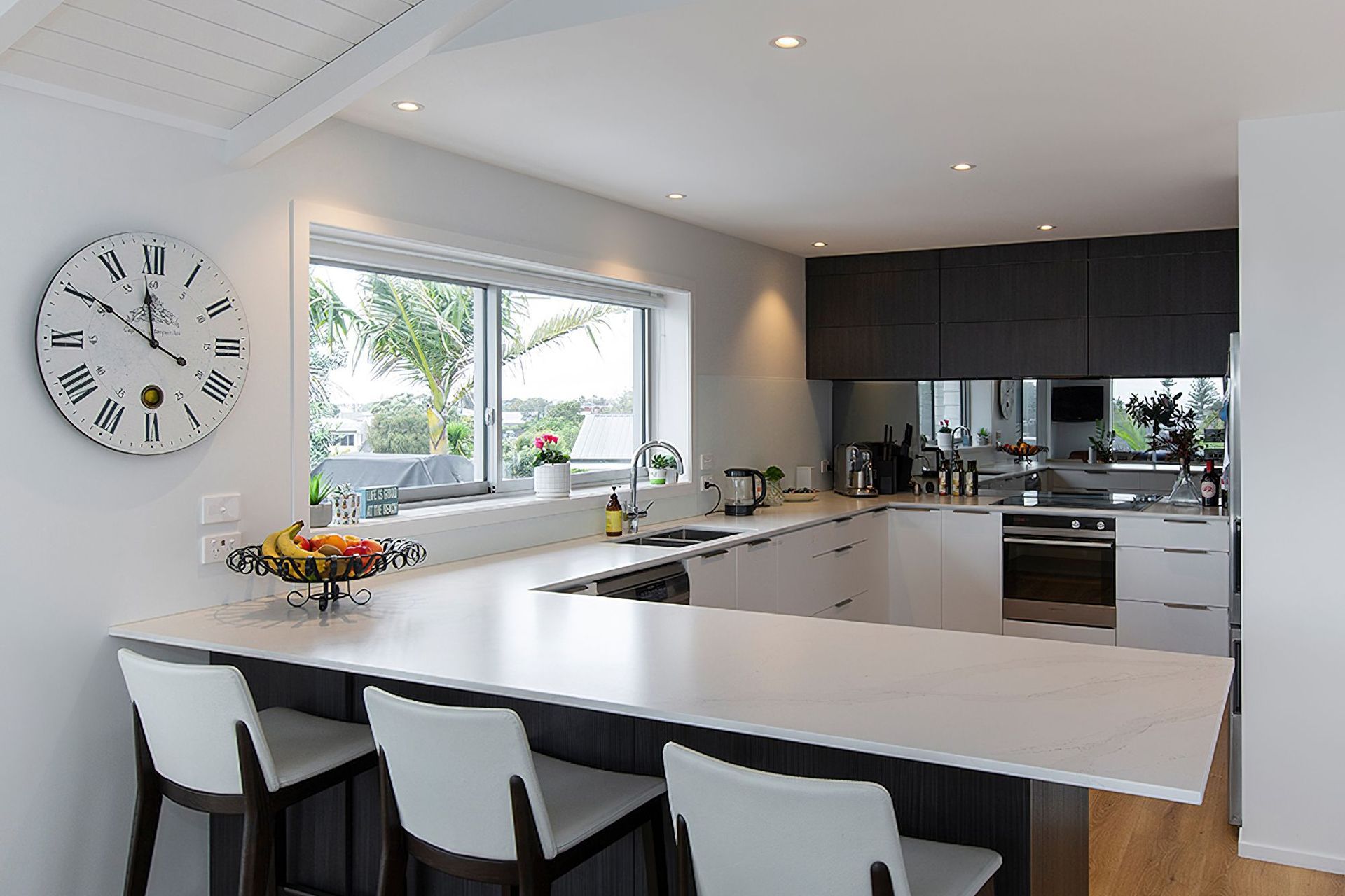 Milan profile in Hacienda Black - Woodgrain. Design by Modern Kitchens. Photography by Liam Dijk.