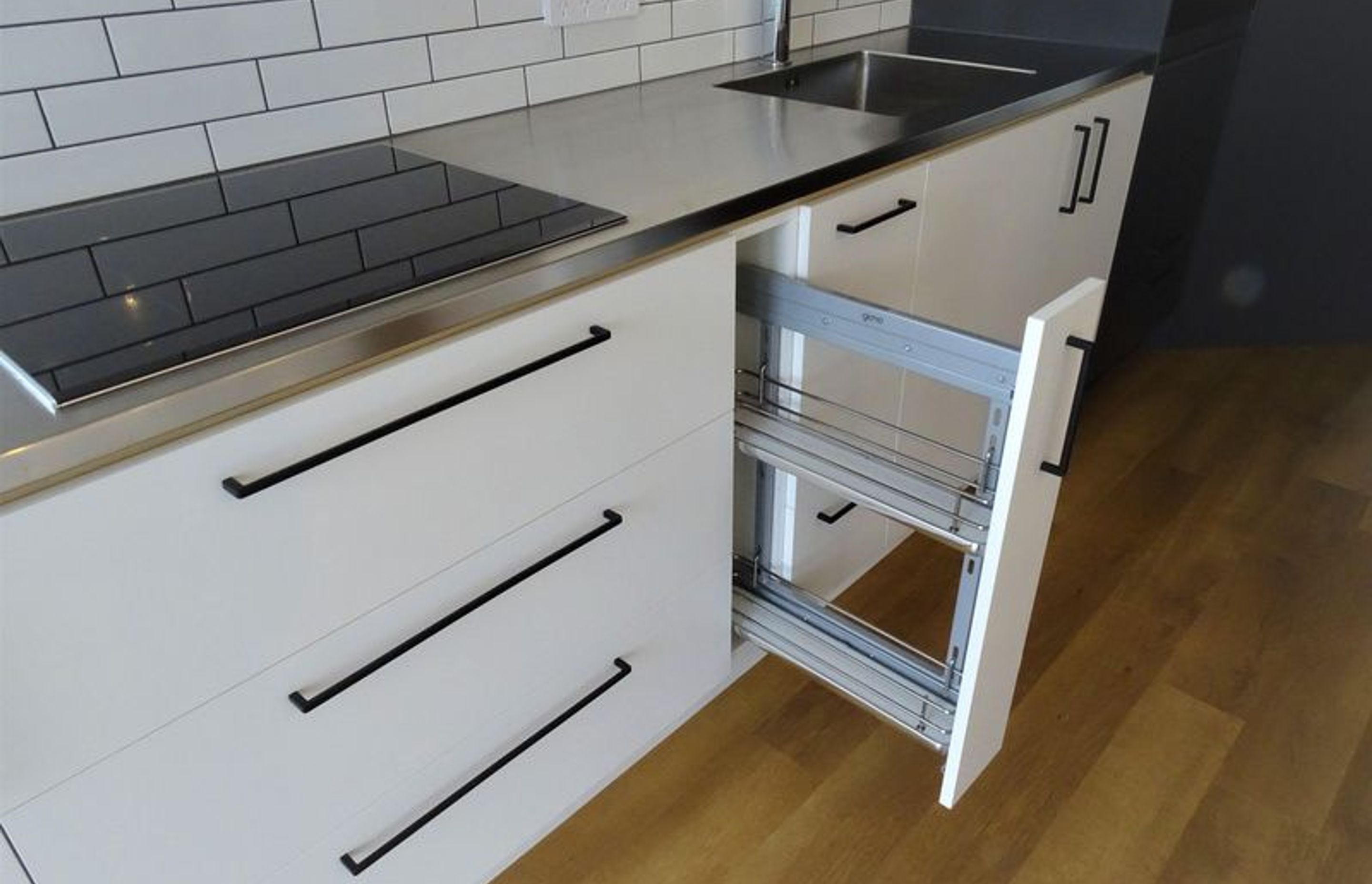 Handy Kitchen storage for spices and sauces right next to the oven