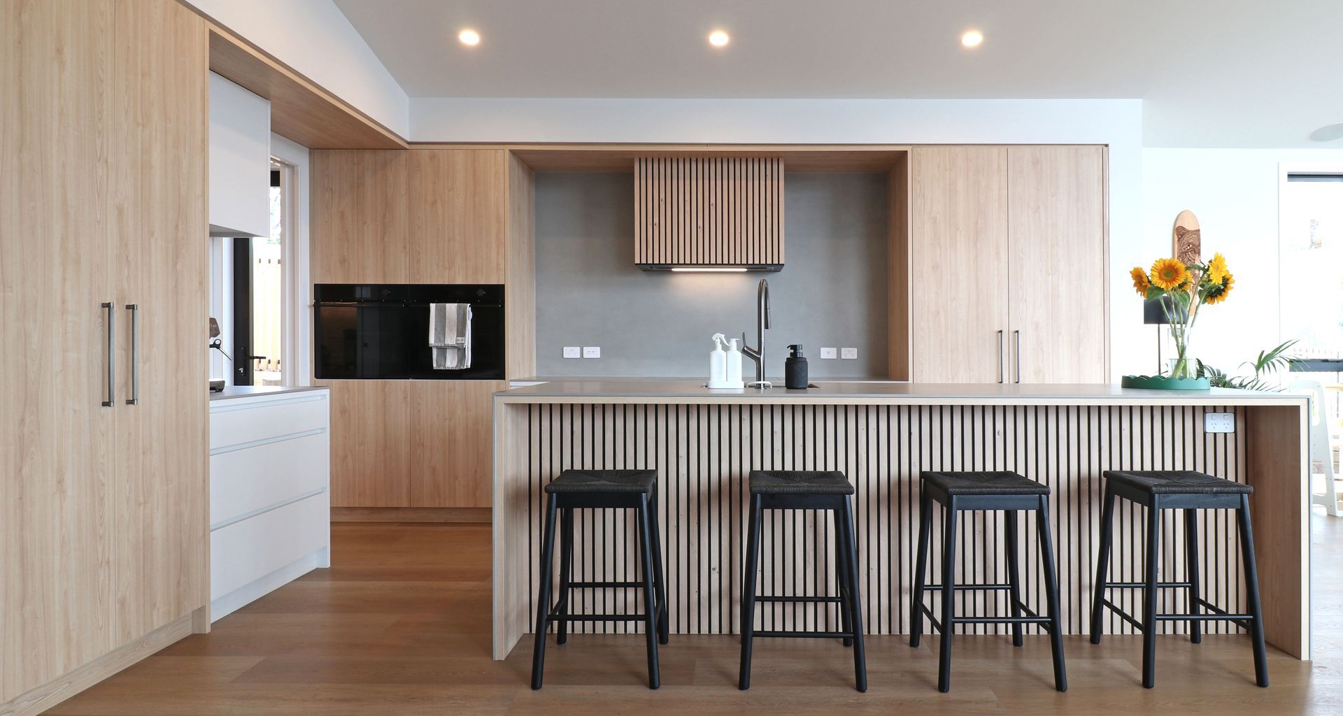 Elevated Elegance: A Family Kitchen Framing Harbour Views banner