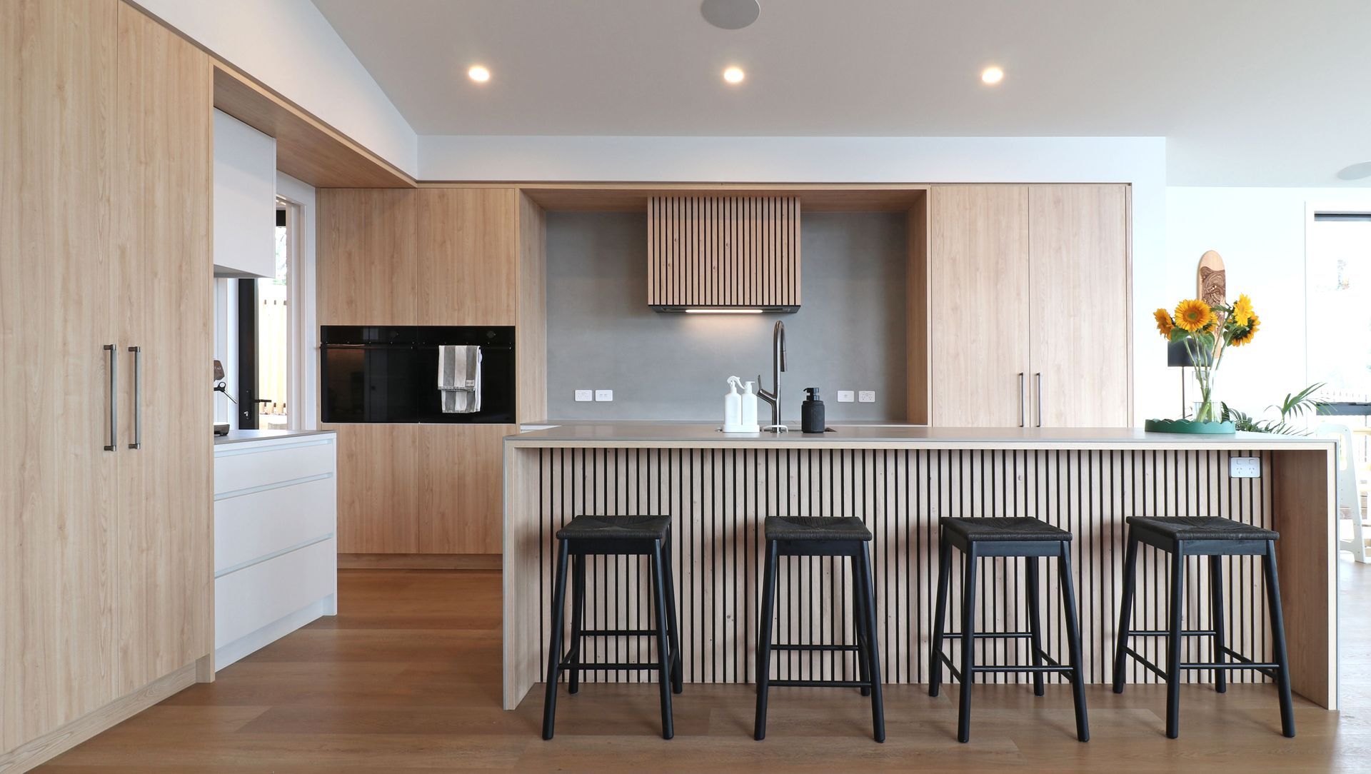 Elevated Elegance: A Family Kitchen Framing Harbour Views banner