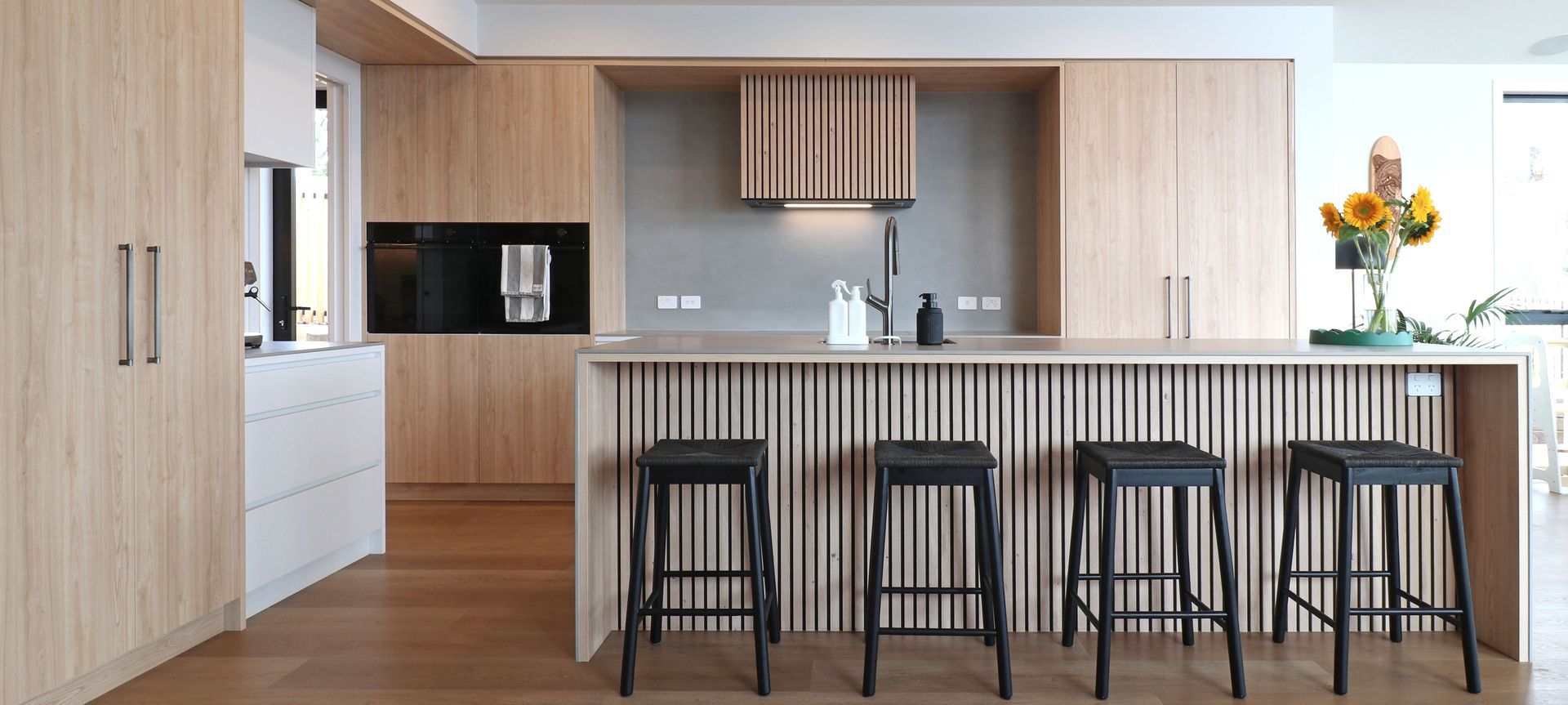 Elevated Elegance: A Family Kitchen Framing Harbour Views banner