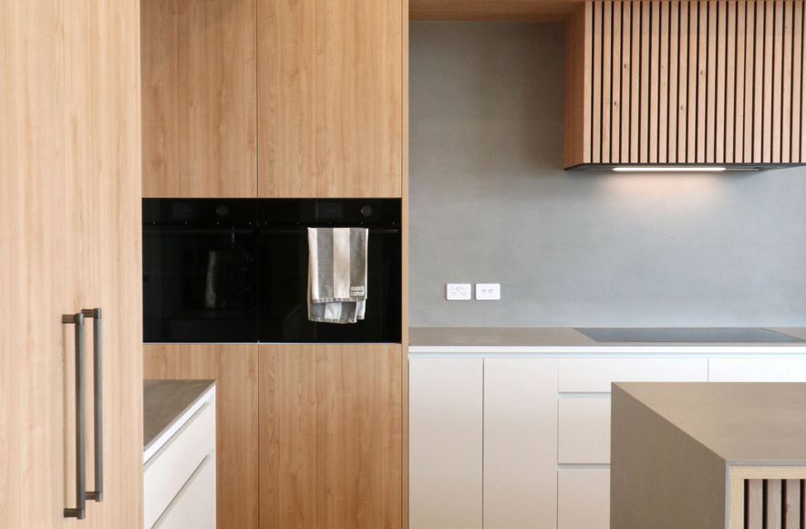Elevated Elegance: A Family Kitchen Framing Harbour Views