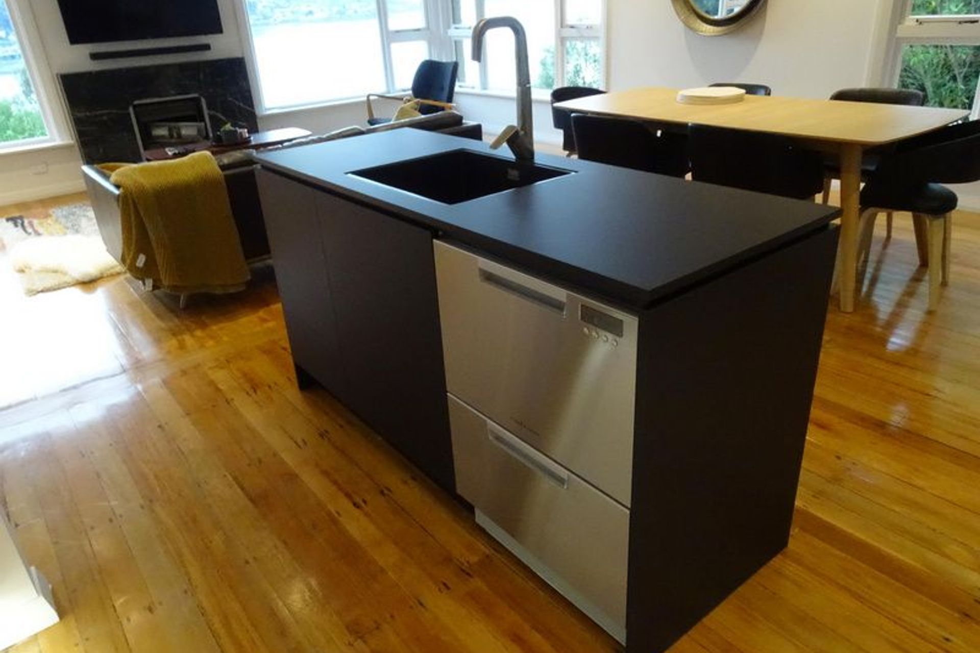 Kitchen Island incorporating stainless steel appliances and tap ware
