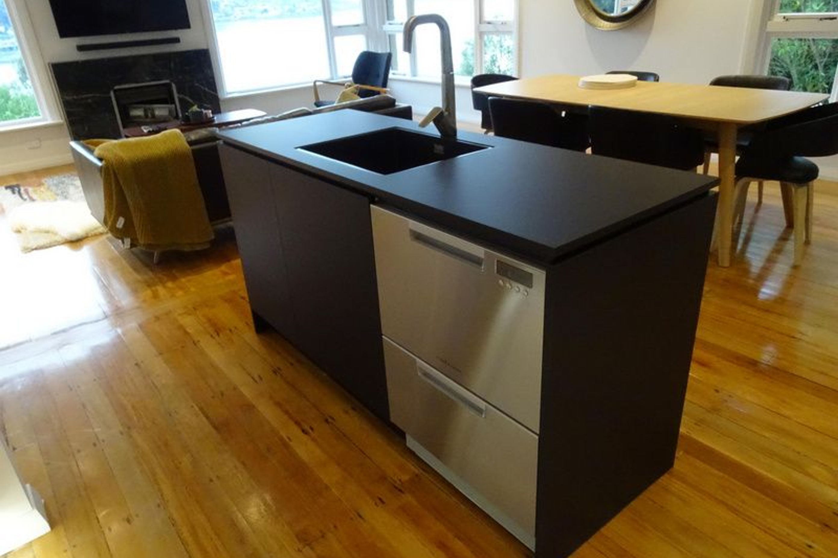 Kitchen Island incorporating stainless steel appliances and tap ware