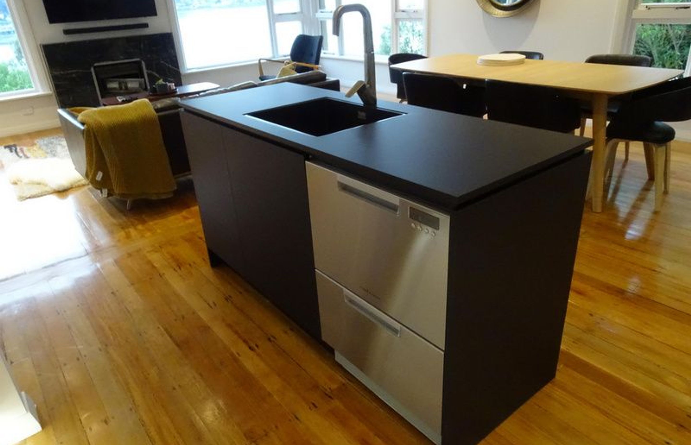 Kitchen Island incorporating stainless steel appliances and tap ware