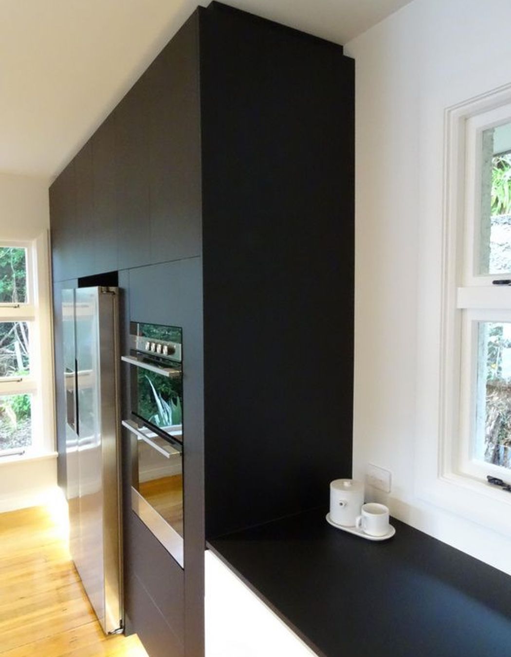 The kitchen cabinetry merges into the bench top