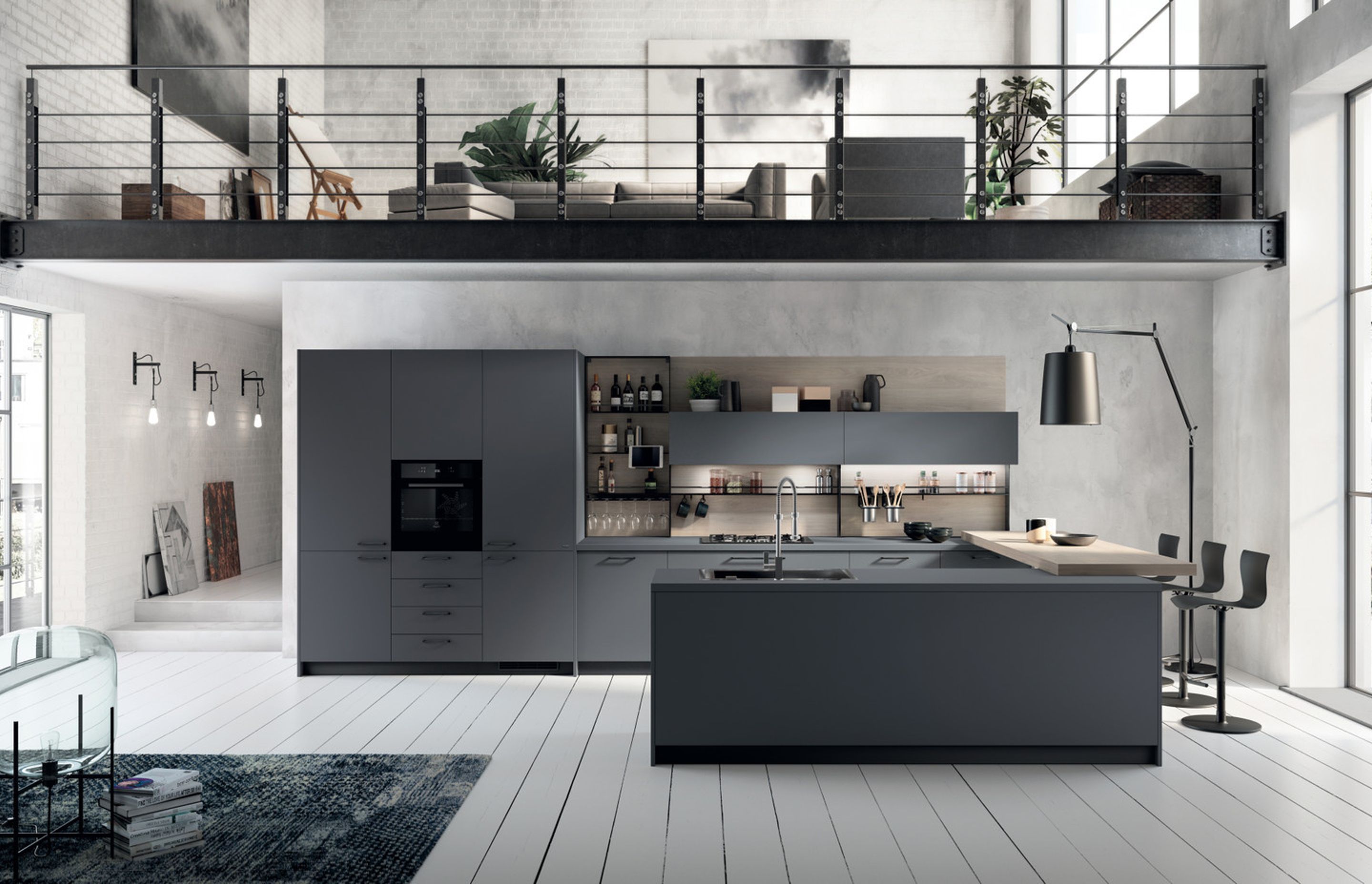 The perfect match between worktop and doors: Bromine Grey Fenix NTM® emphasises the metropolitan soul of this kitchen fitted with every convenience, starting with the "Setup" accessorised wall panel, in satin finish Anthracite finish, and equipped with multiple useful accessories (kitchen roll holder, shelves, bars, hooks, etc.).