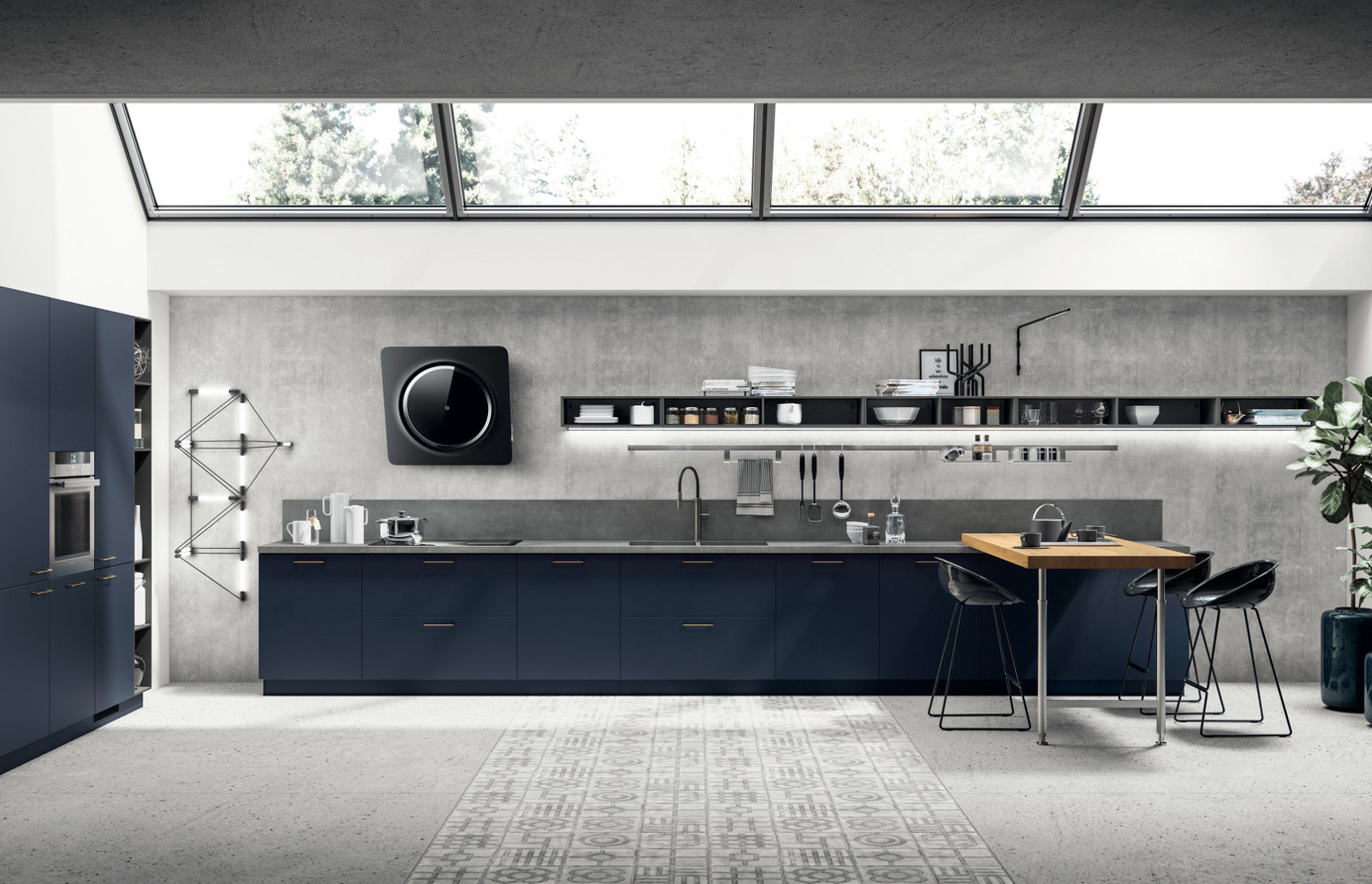 A modern kitchen with a notable navy feel: the new Moon Blue lacquered finish on the base units and tall units is matched perfectly by the breakfast bench in Nordik Oak fitted with Slender support.