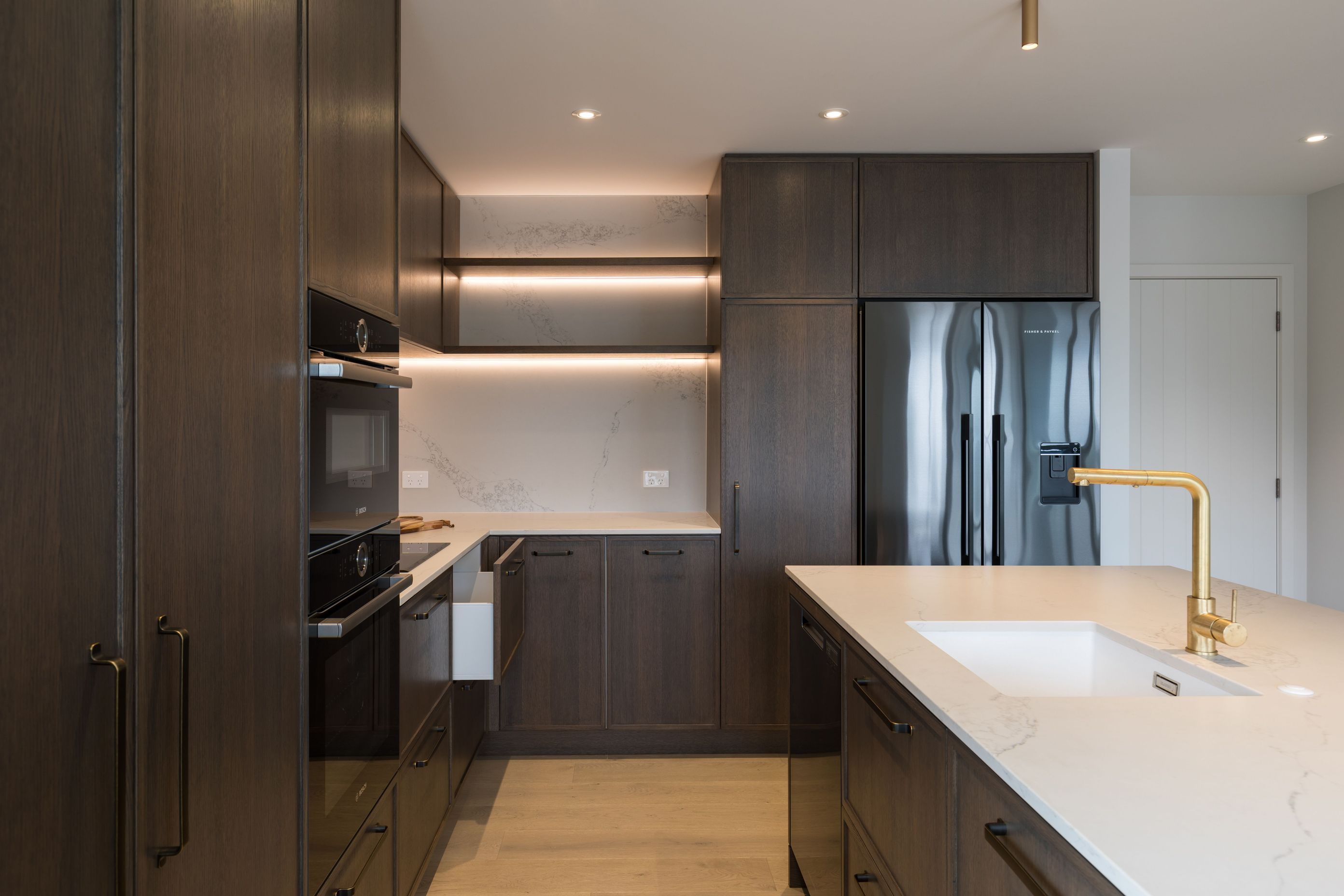 Prime Stone, Calacatta Formosa - Honed / Prime Veneer, American White Oak - Quarter Cut. Design by Susan Lands, Stratford Interior Design.