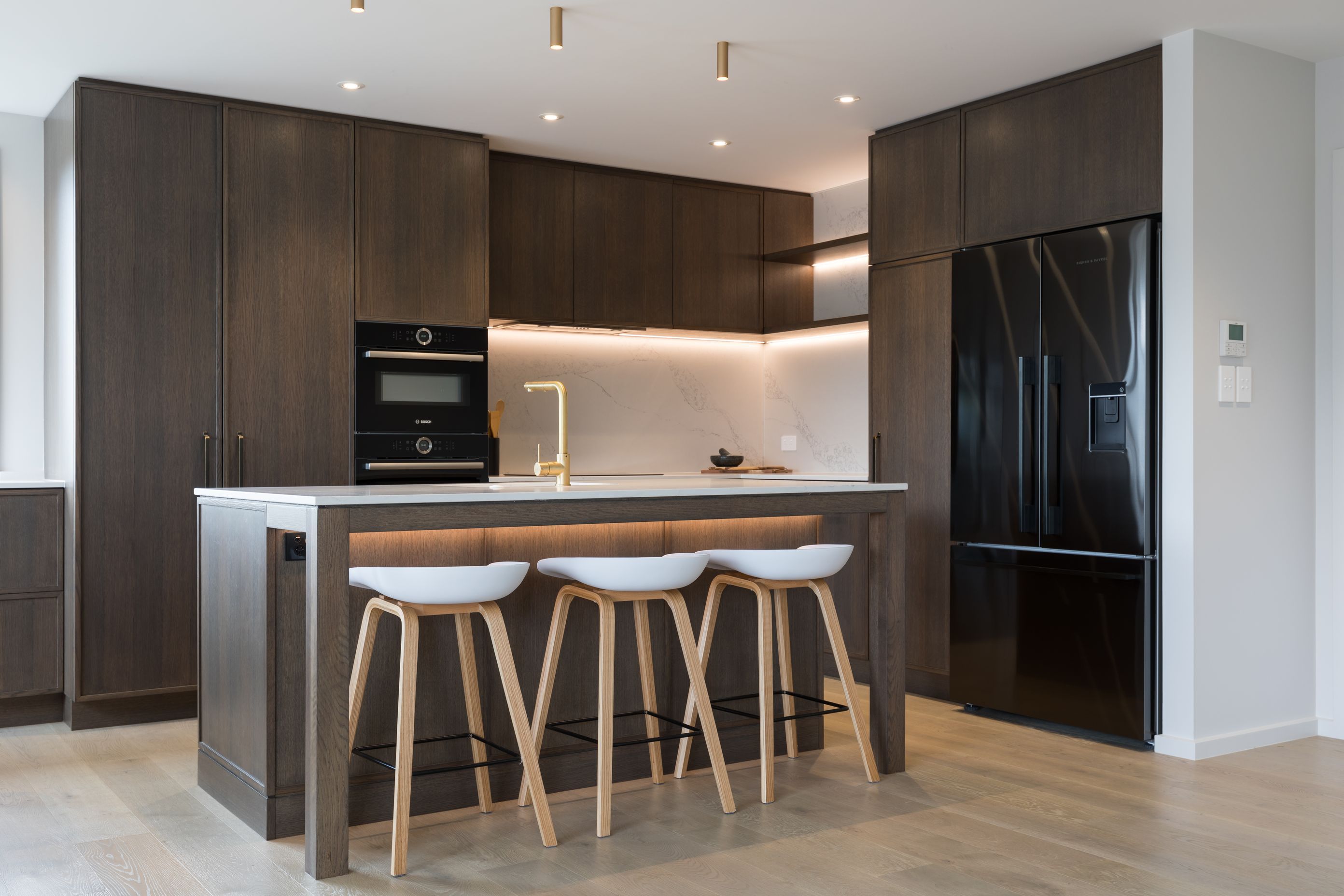 Prime Stone, Calacatta Formosa - Honed / Prime Veneer, American White Oak - Quarter Cut. Design by Susan Lands, Stratford Interior Design.