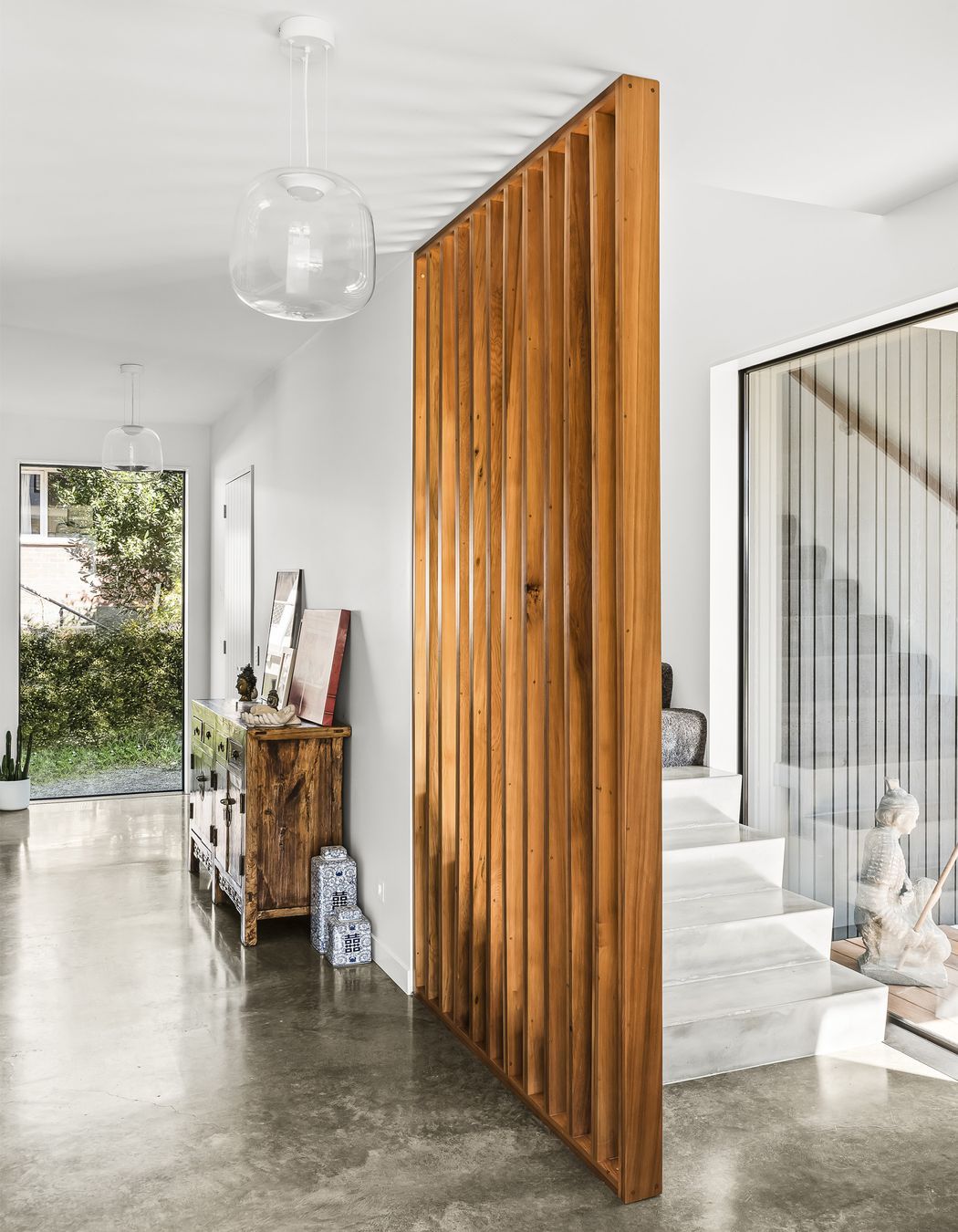 Screening for the stairs is made from matai rescued from floorboards pulled out of the original home on the property.