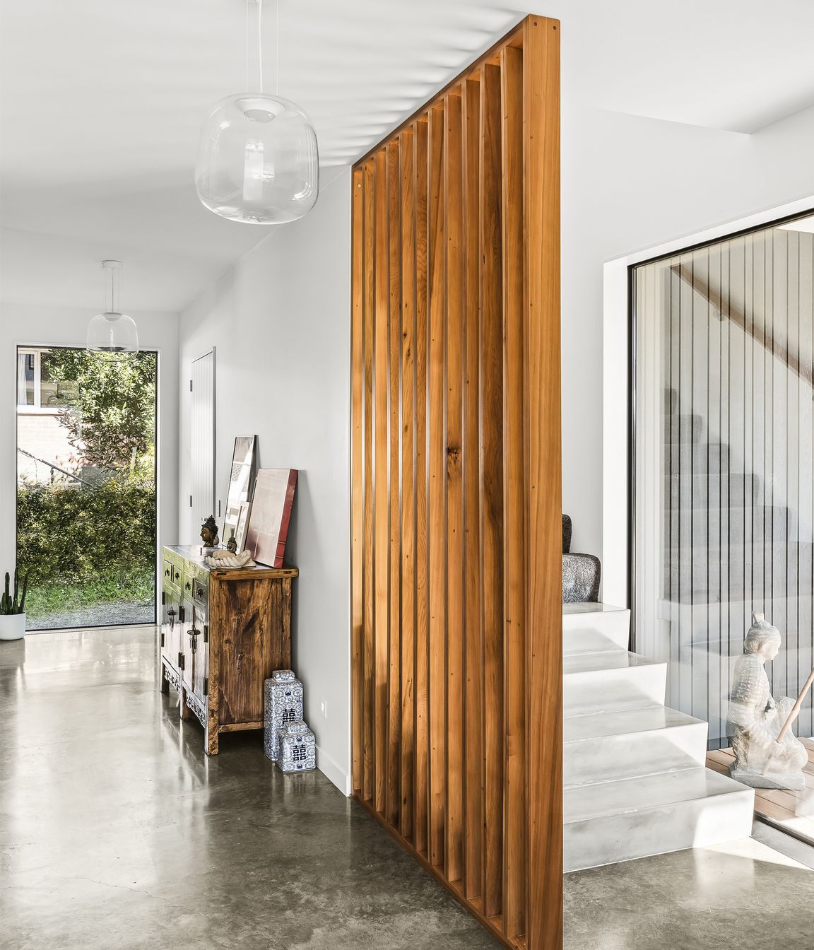 Screening for the stairs is made from matai rescued from floorboards pulled out of the original home on the property.