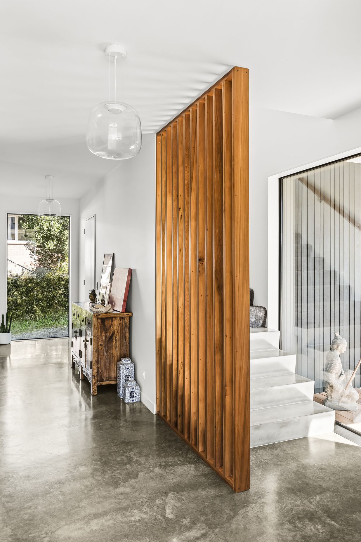 Screening for the stairs is made from matai rescued from floorboards pulled out of the original home on the property.