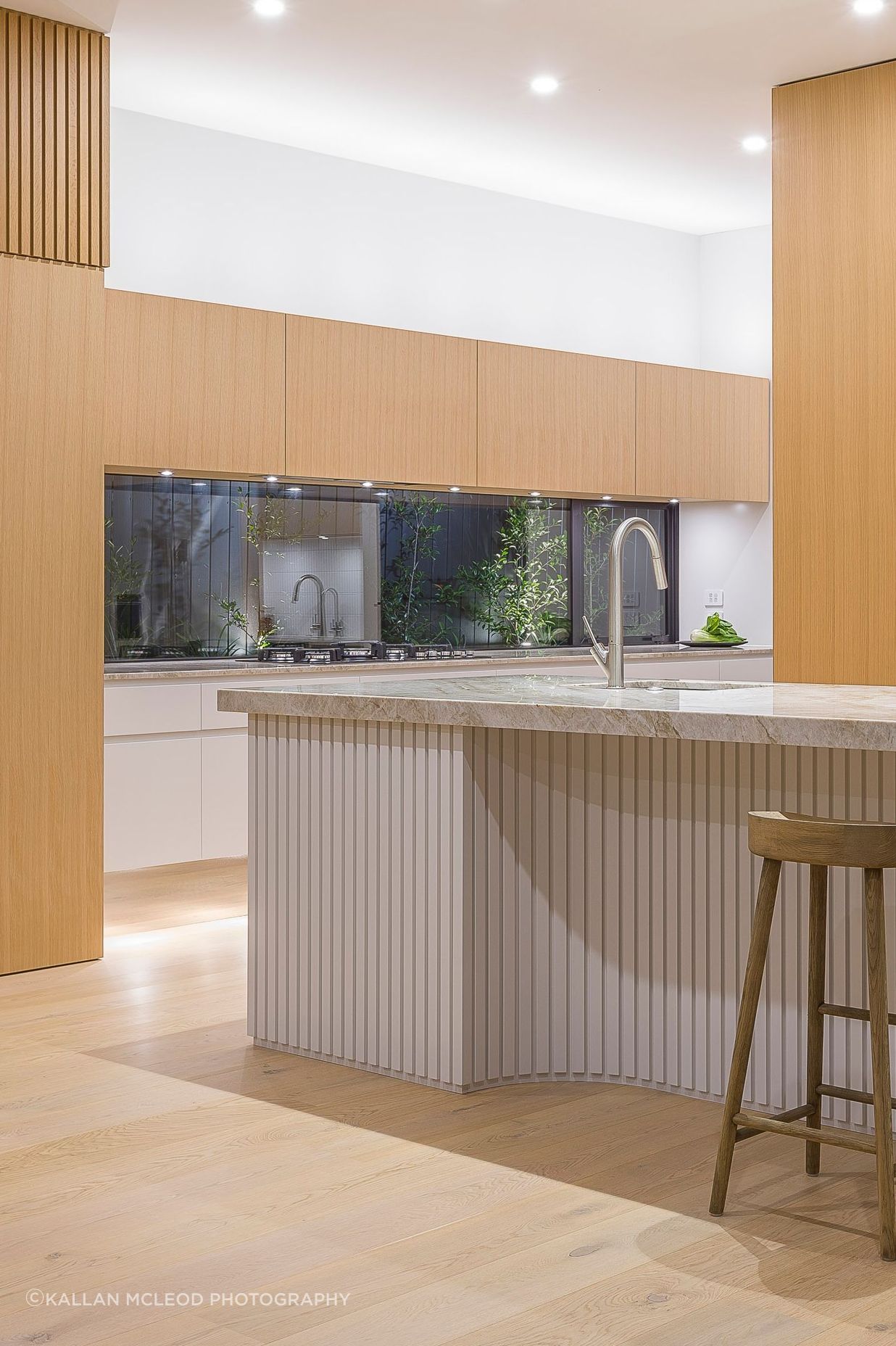Designed in 2019 before battened sheets became mainstream, each ‘pleat’ is carefully predetermined and dimensioned to read as evenly spaced even within the internal curvature. Like a perfectly hemmed garment, the battens just lightly skirt the floor.