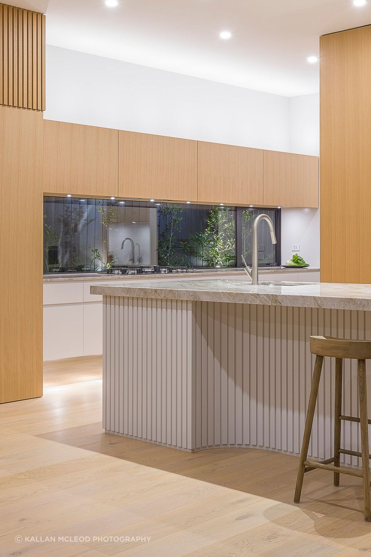 Designed in 2019 before battened sheets became mainstream, each ‘pleat’ is carefully predetermined and dimensioned to read as evenly spaced even within the internal curvature. Like a perfectly hemmed garment, the battens just lightly skirt the floor.