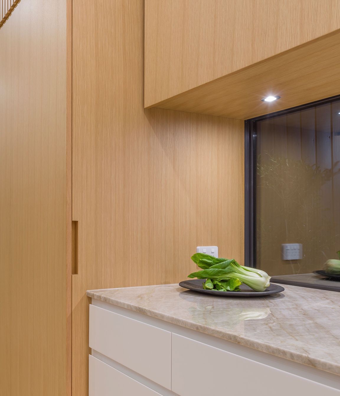 For the home planning centre and tall ‘breakfast pantry’, custom oak recessed handles are handcrafted with precision to fold seamlessly into the veneer door faces and side.
