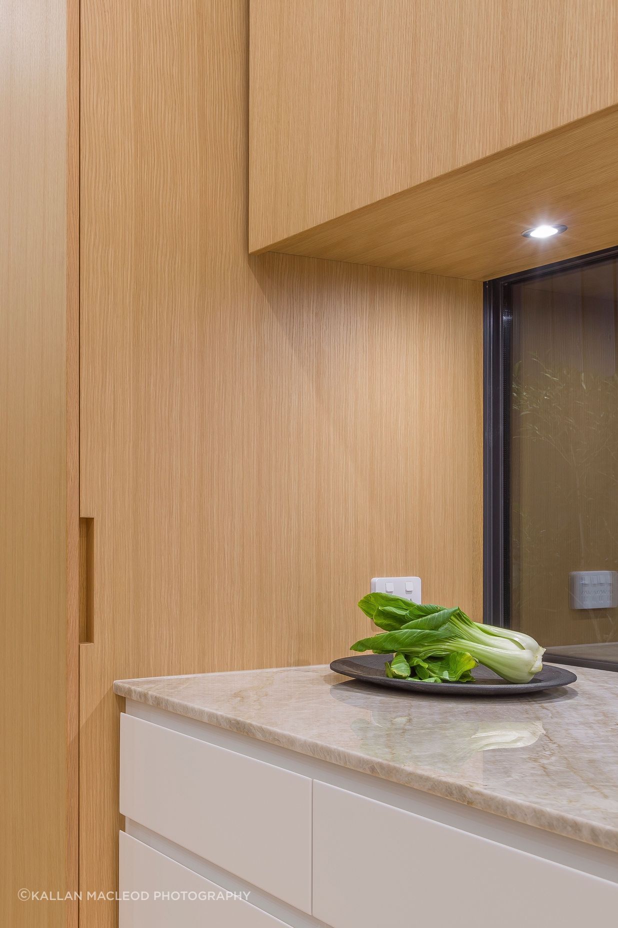 For the home planning centre and tall ‘breakfast pantry’, custom oak recessed handles are handcrafted with precision to fold seamlessly into the veneer door faces and side.