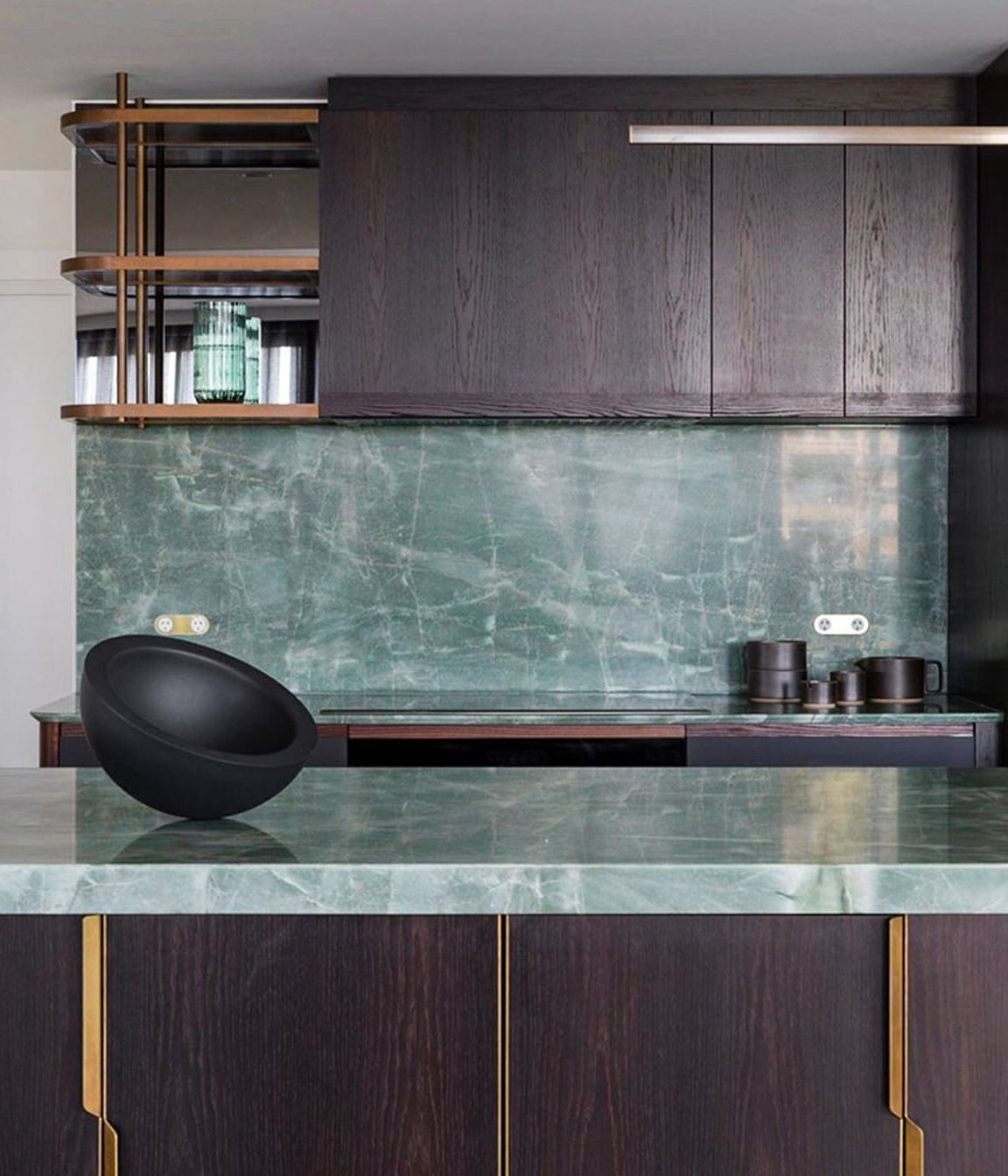 We designed custom brass handles and shelving for the kitchen.