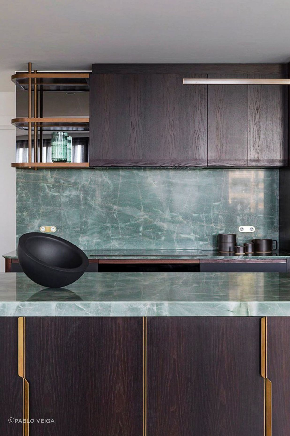 We designed custom brass handles and shelving for the kitchen.