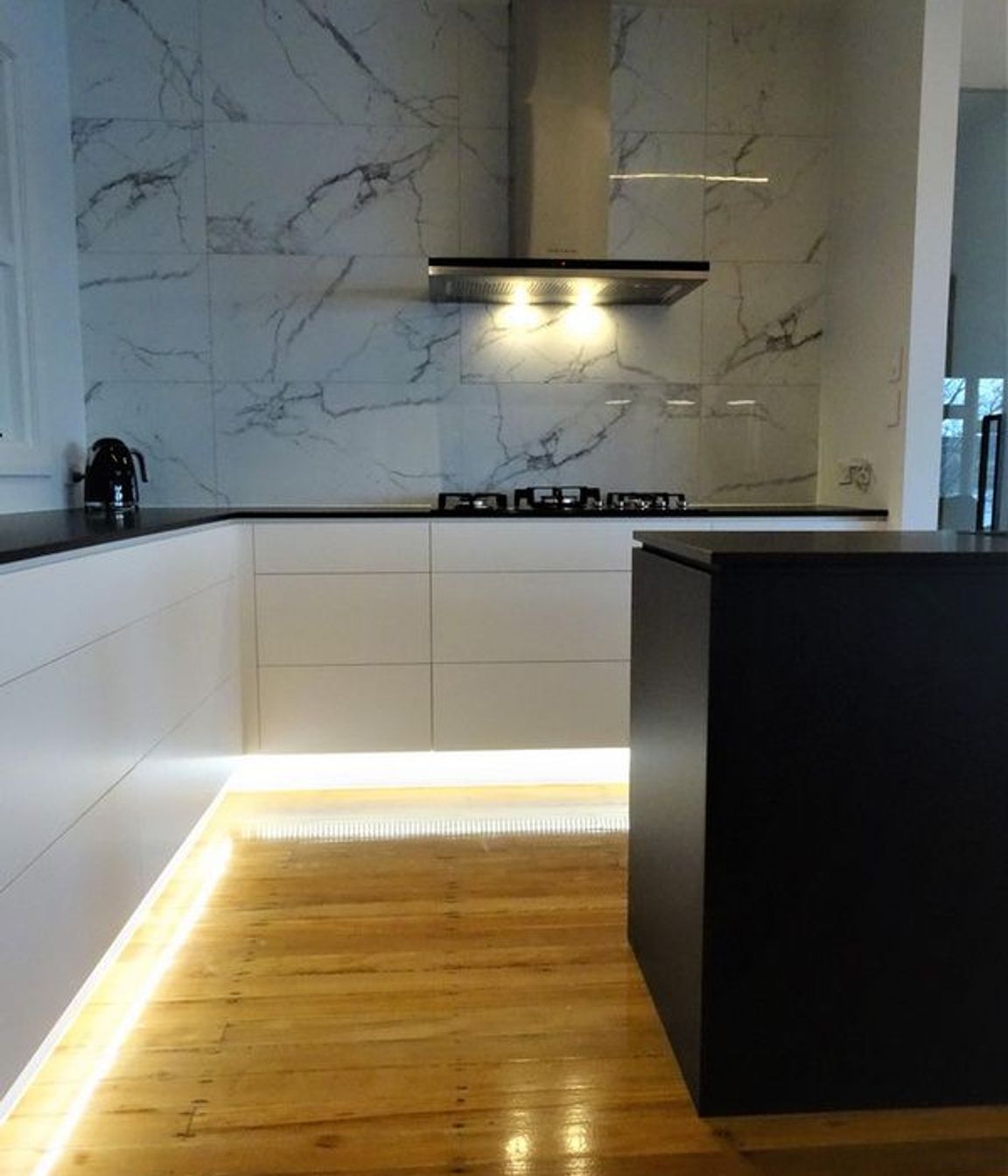 The lighting and marble kitchen