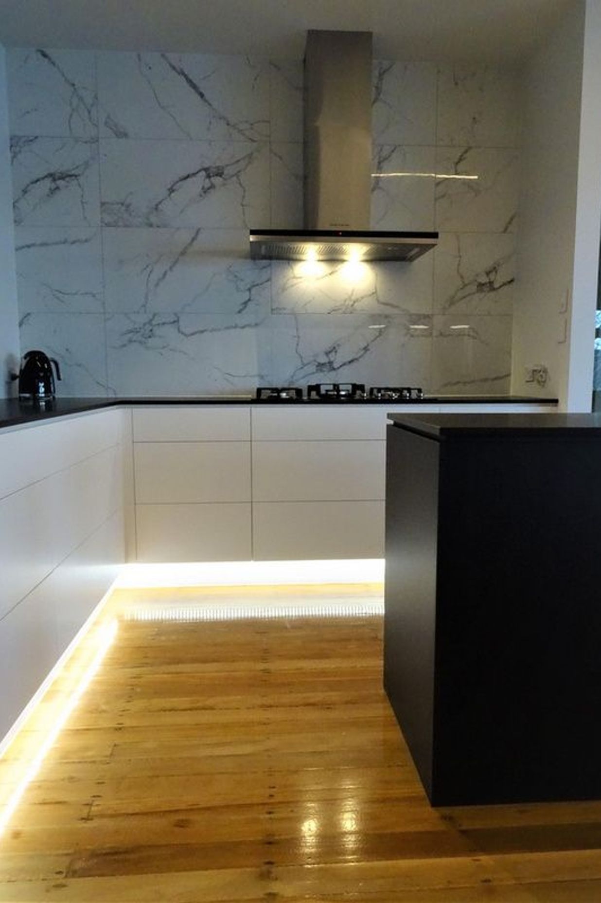 The lighting and marble kitchen