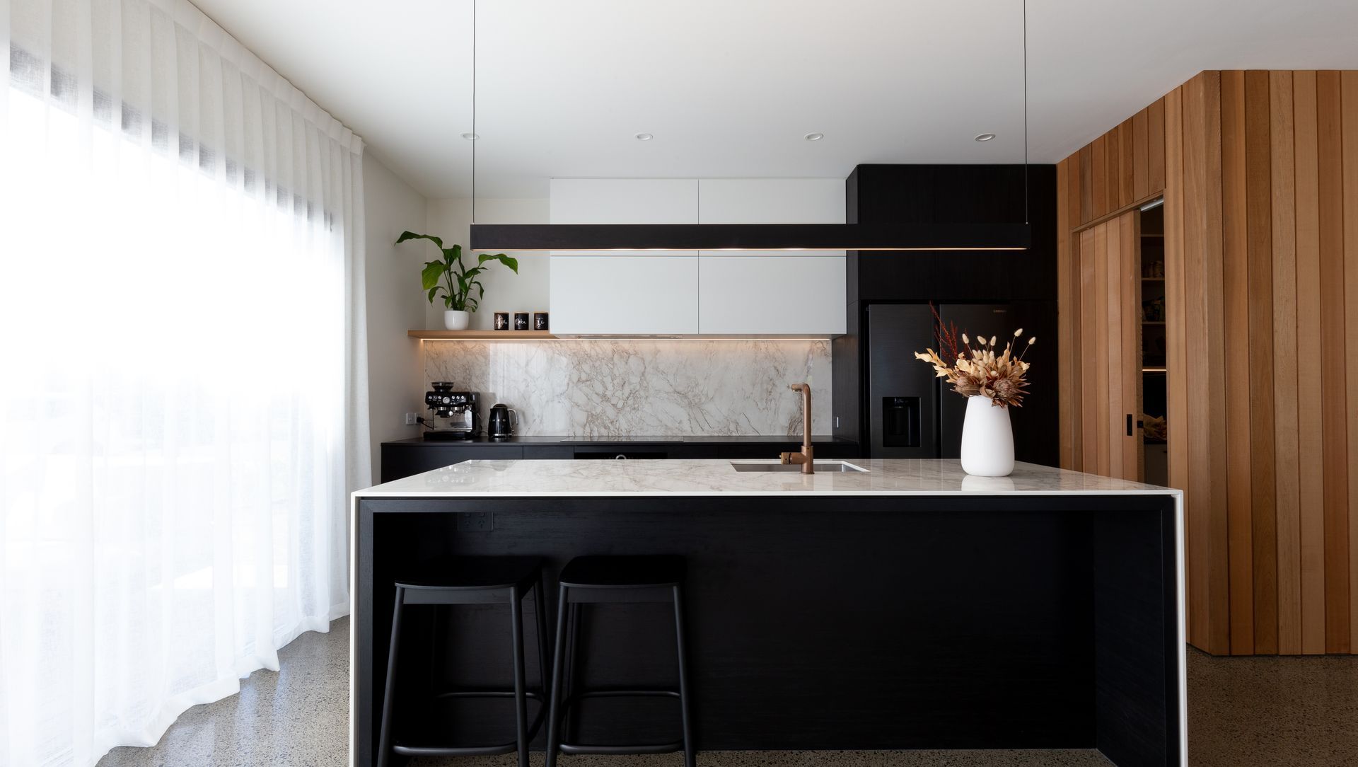 A Contemporary Black Kitchen Features Dekton Bergen banner