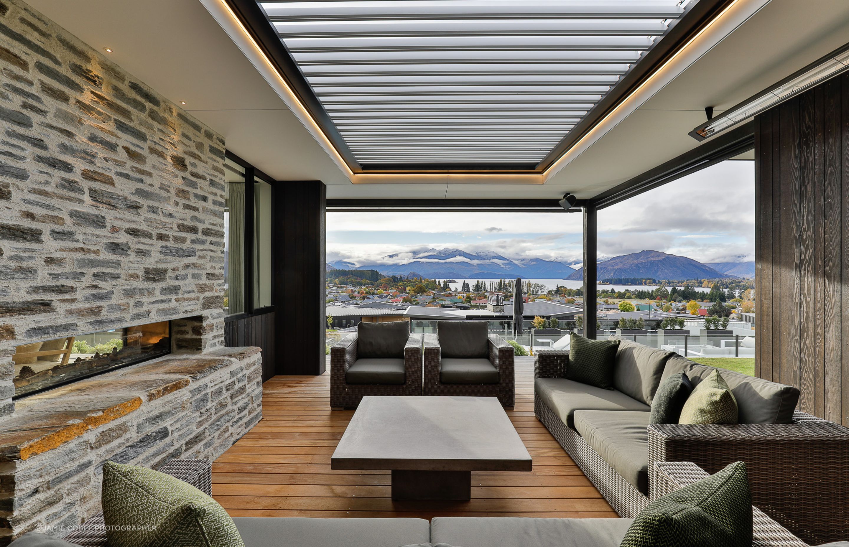 Outdoor Living Room with louvres overhead and ceiling mounted directional heaters. Interior Design- Kelly @ Archi Build Ltd.