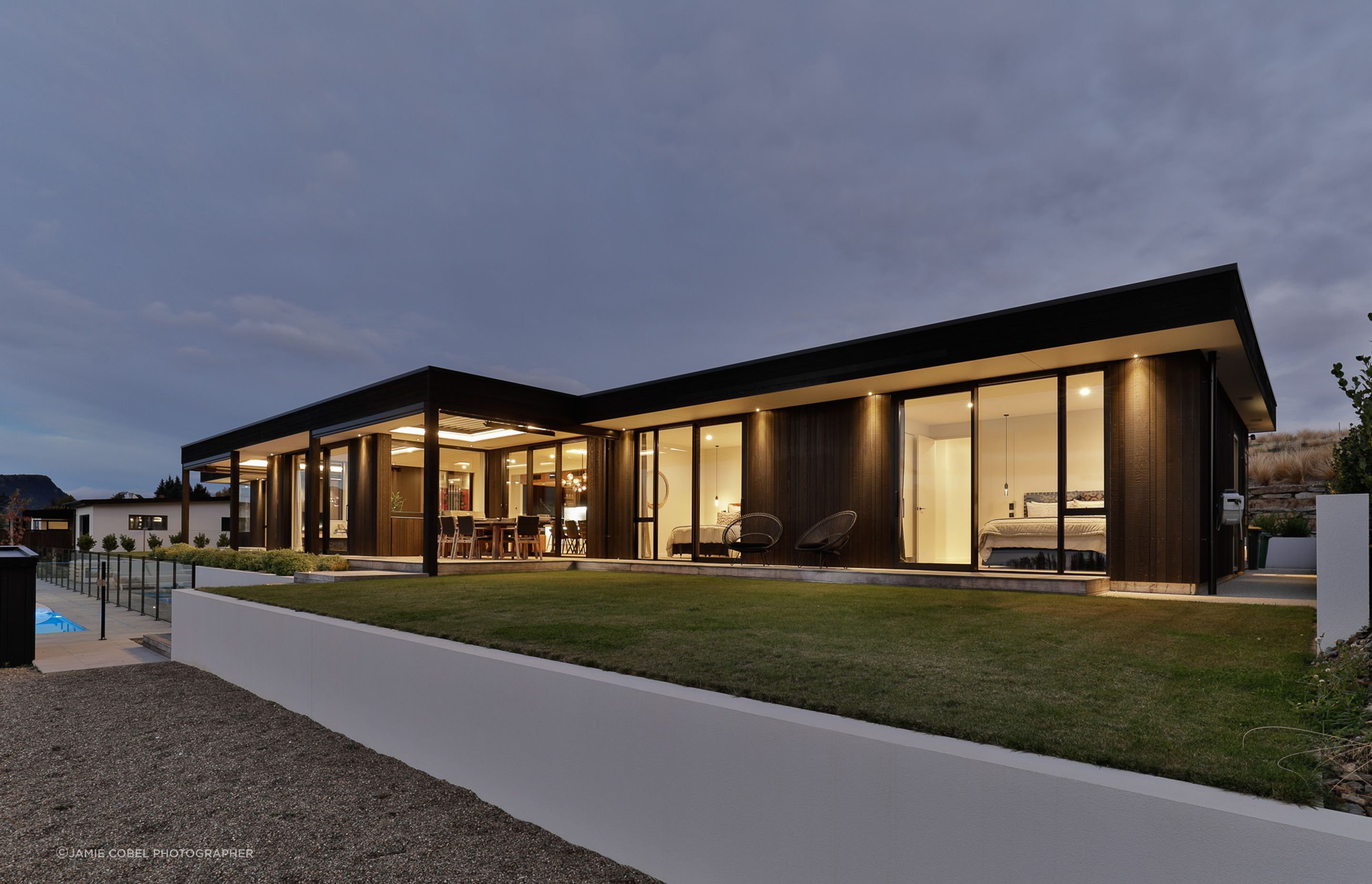 Exterior by night- Guest bedrooms wing. Interior Design- Kelly @ Archi Build Ltd.