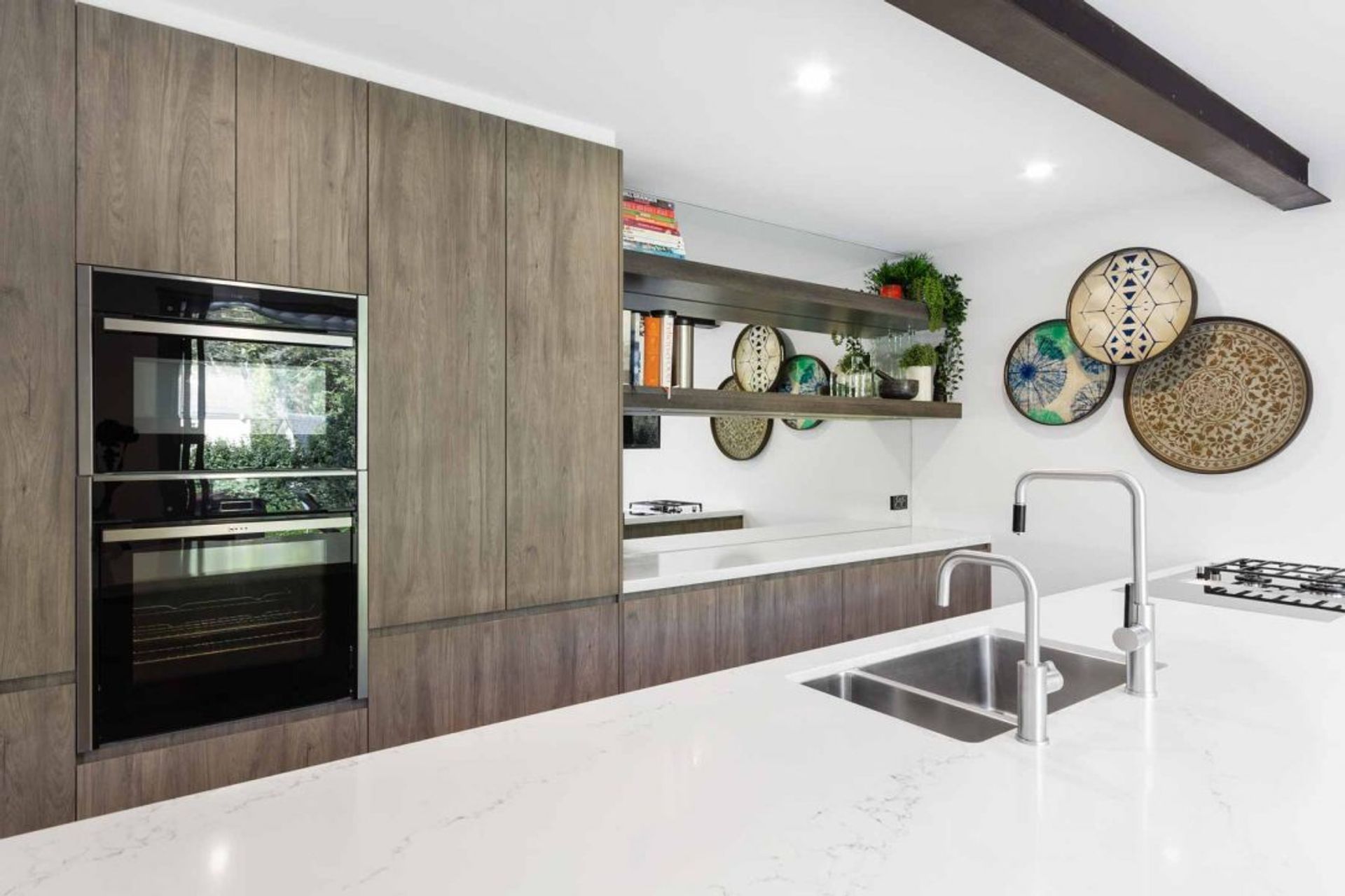 kitchen-design-miele-quantum-quartz-bora-neff-oven-polytec-timber-grain-cabinets-3-1084x723-v3.jpg