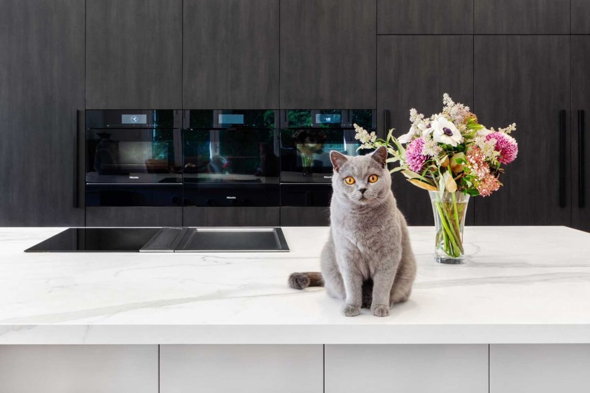 premier-kitchen-design-sydney-neolith-dekton-benchtop-splashback-dark-timber-white-cabinets-01-1084x723.jpg