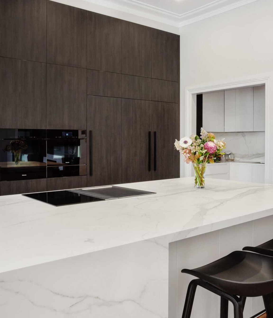 premier-kitchen-design-sydney-neolith-dekton-benchtop-splashback-dark-timber-white-cabinets-03-1084x1626.jpg