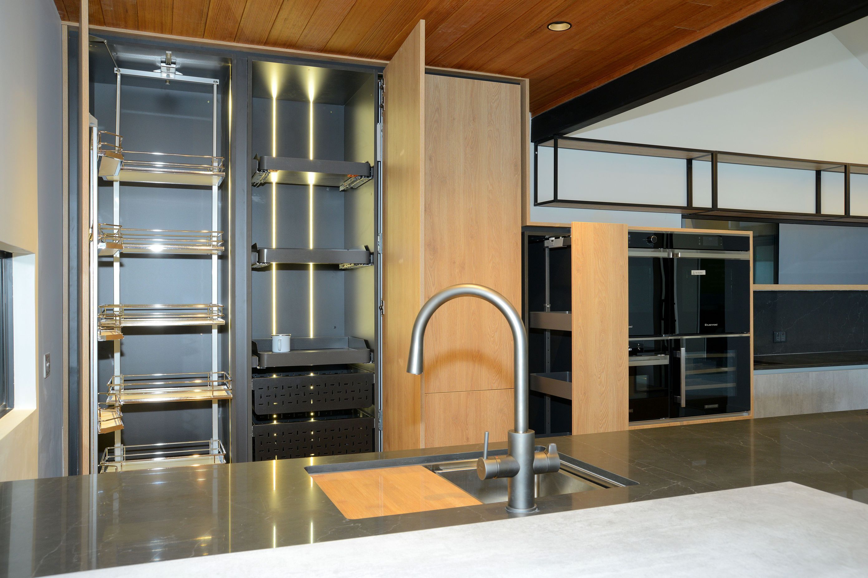 On Left - Vauth Sagel TAL Gate Pro Pantry. On Right - Three Vauth Sagel SUB Baskets in Planero Style Installed with Tanova Ventilated Drawers.