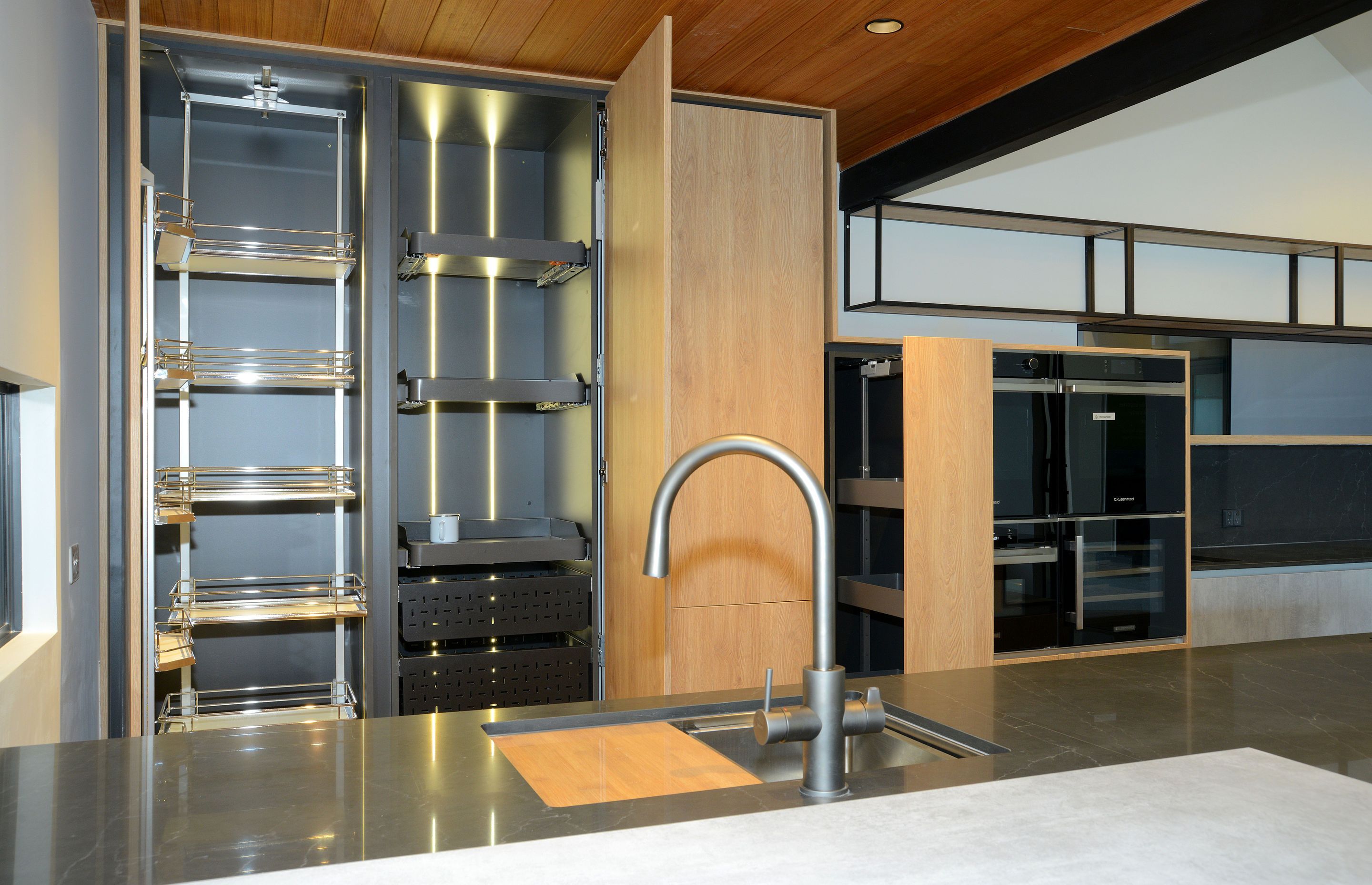 On Left - Vauth Sagel TAL Gate Pro Pantry. On Right - Three Vauth Sagel SUB Baskets in Planero Style Installed with Tanova Ventilated Drawers.