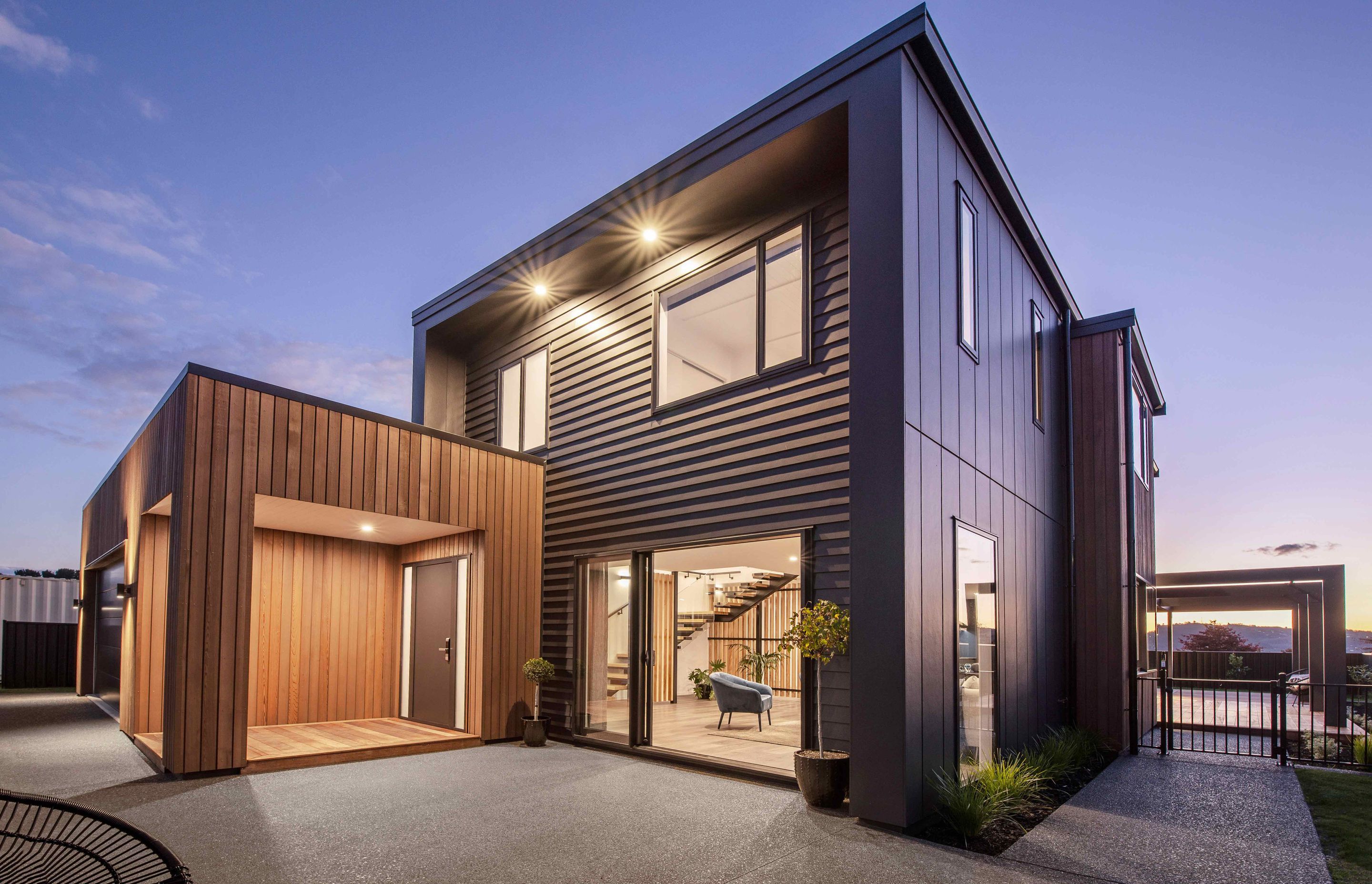 For the exterior, a mix of eye-catching materials was chosen, including vertical cedar, traditional weatherboards and Stria panels.