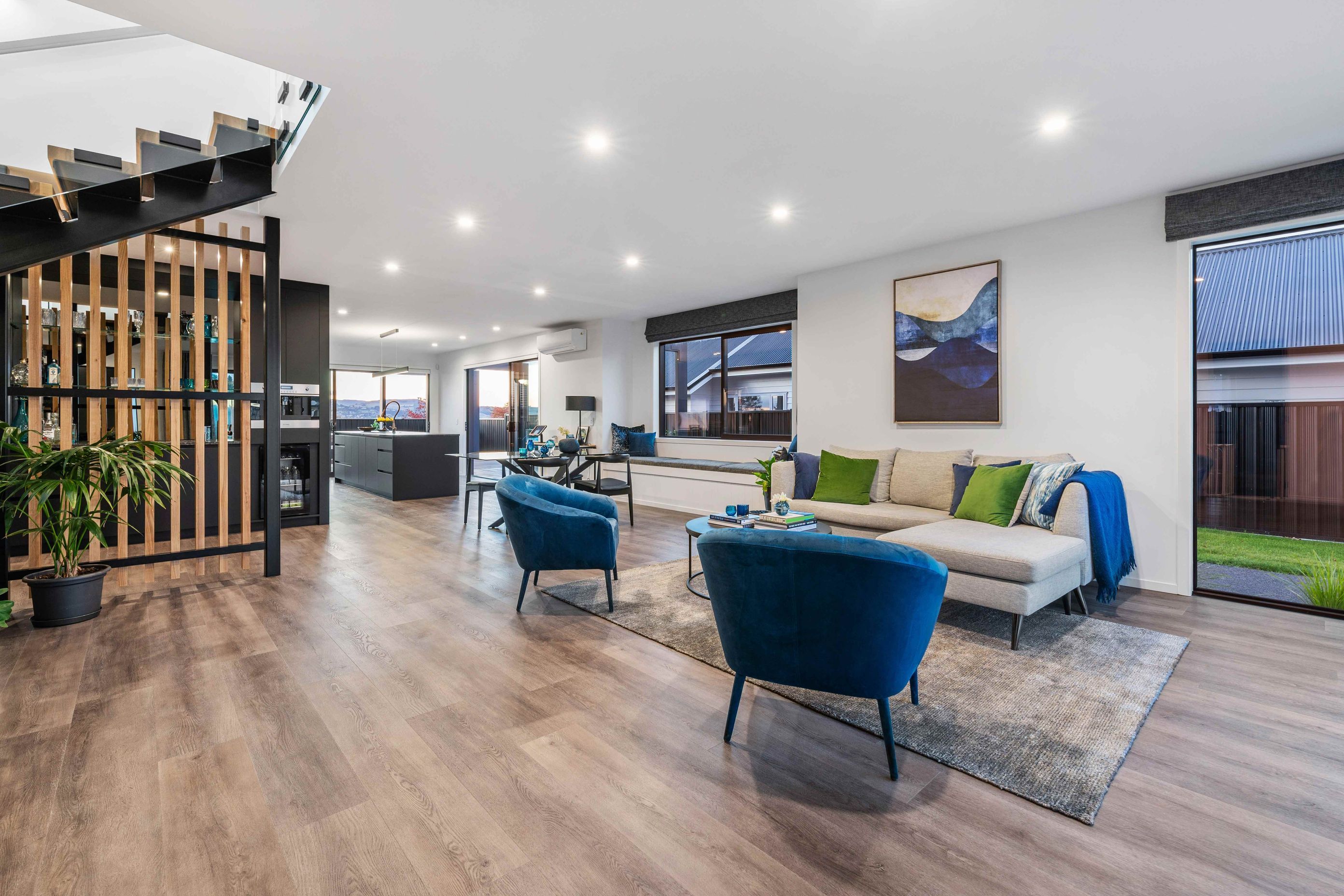 Open plan living is the call of the day on the lower level, with the living areas oriented towards the lake views to the north.