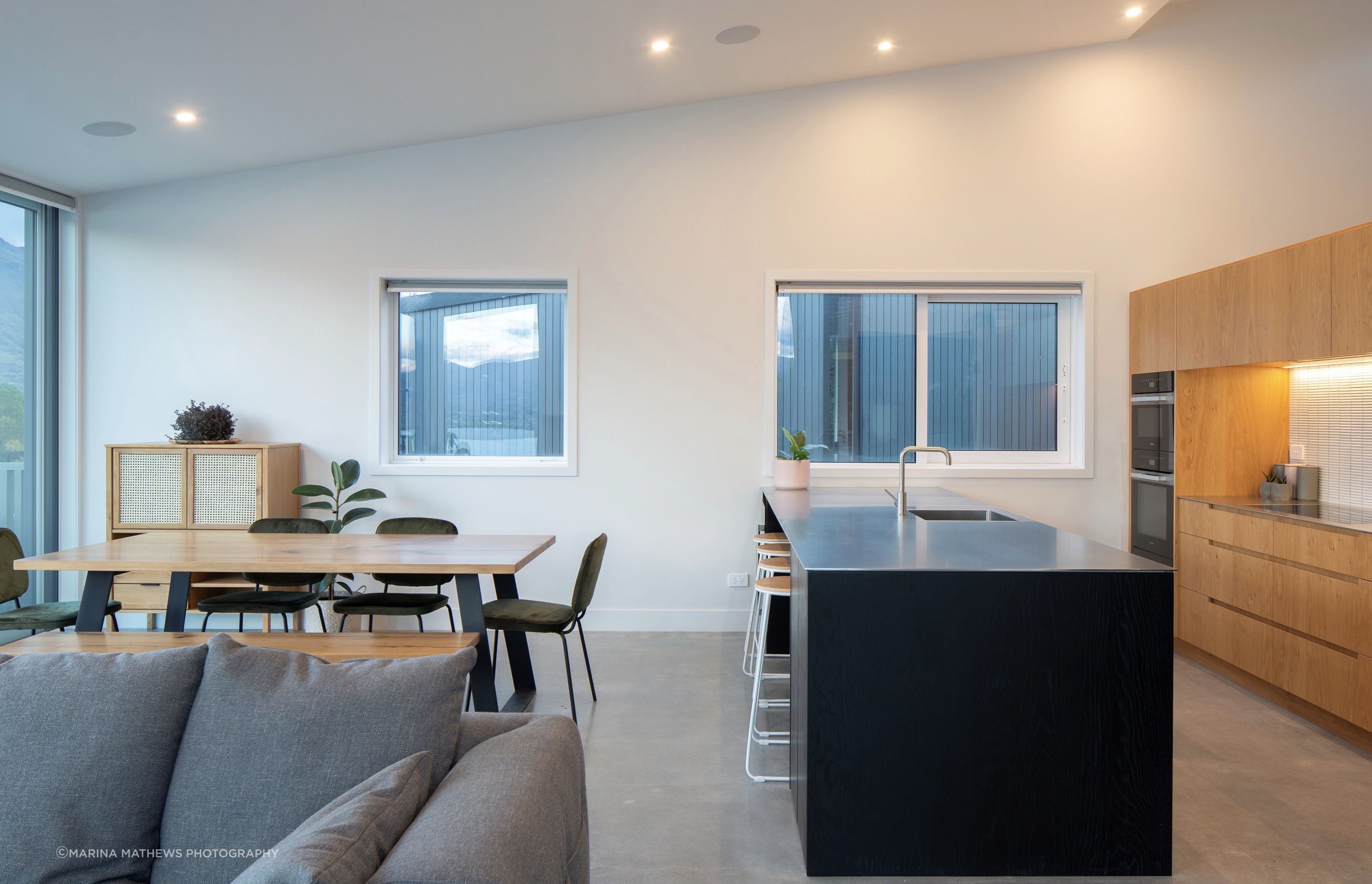 Kitchen and Dining rooms with high level sloped ceilings