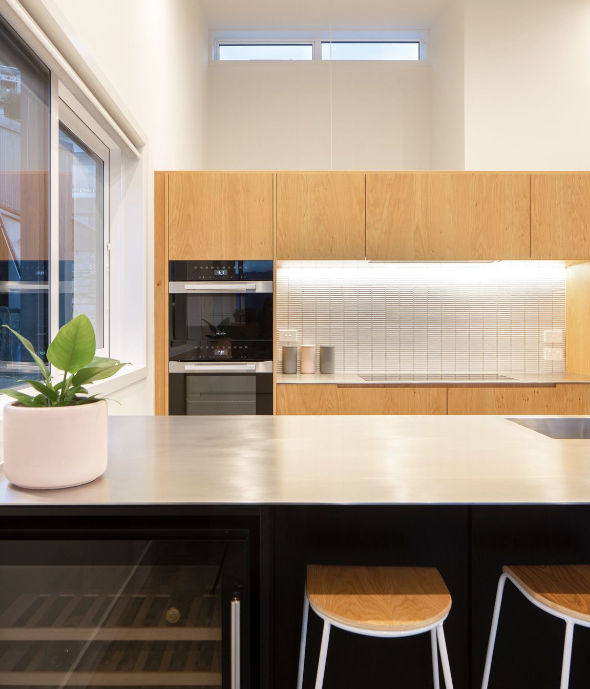 Bespoke kitchen joinery with high level glazing at the rear